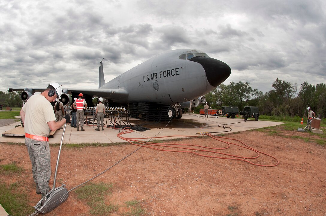 The 362nd Training Squadron, Crash Damaged Disabled Aircraft Recovery (CDDAR) team, used 26-ton airbag modules and associated equipment to completely lift a KC-135 Stratotanker July 29, 2014. Students work as a team to lift the aircraft off the ground a minimum of 8 inches, which can be applied to any aircraft that has skidded off the runway or is stuck in the mud, snow or any other terrain. (U.S. Air Force photo/Danny Webb/RELEASED)