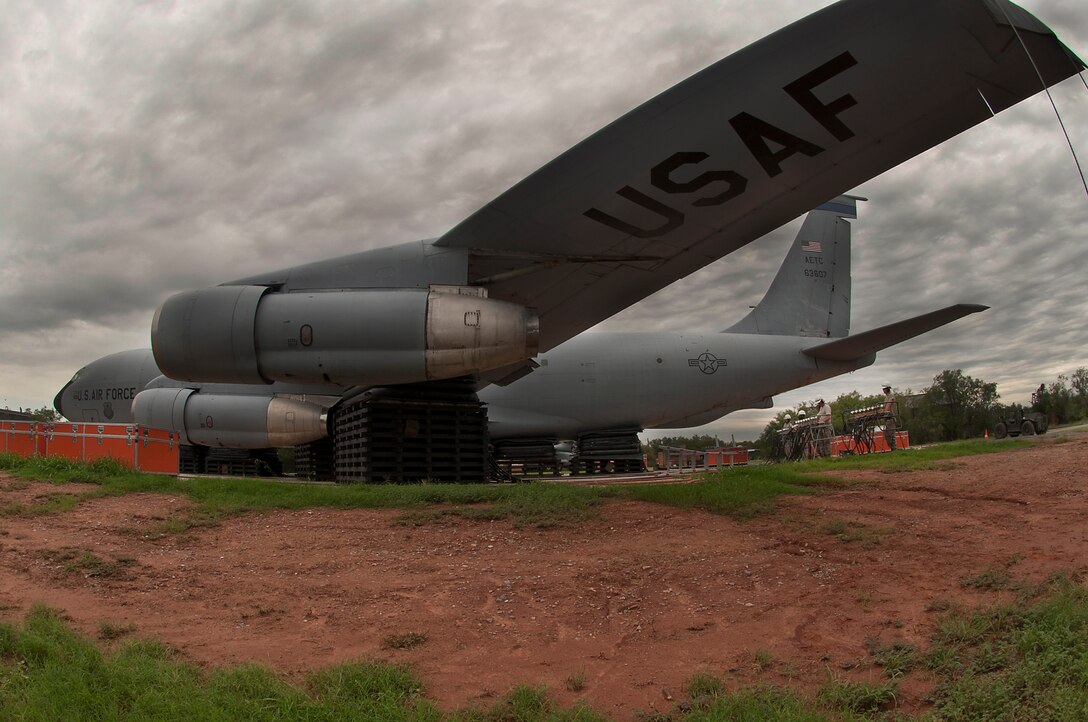 The 362nd Training Squadron, Crash Damaged Disabled Aircraft Recovery (CDDAR) team, used 26-ton airbag modules and associated equipment to completely lift a KC-135 Stratotanker July 29, 2014. Students work as a team to lift the aircraft off the ground a minimum of 8 inches, which can be applied to any aircraft that has skidded off the runway or is stuck in the mud, snow or any other terrain. (U.S. Air Force photo/Danny Webb/RELEASED)