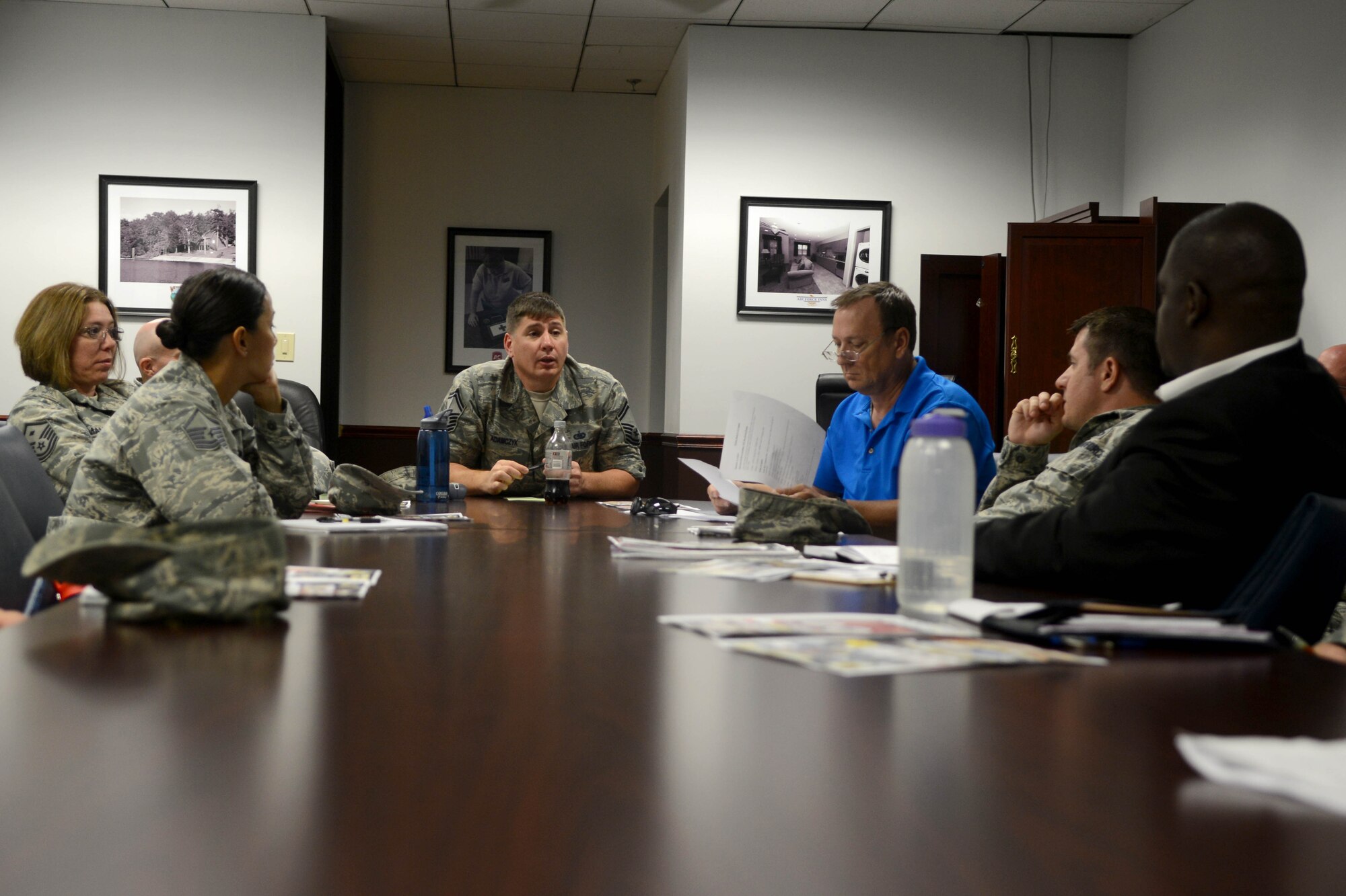 U.S. Air Force Senior Master Sgt. Kenneth Adamczyk, 20th Force Support Squadron acting first sergeant (center), meets with the Big “A” Airman Appreciation and Family Fun Night committee at Shaw Air Force Base, S.C., July 31, 2014. The meeting is to plan base-wide events to recognize E-5 and below and give back to the young enlisted members. (U.S. Air Force photo by Senior Airman Ashley Gardner/Released)
