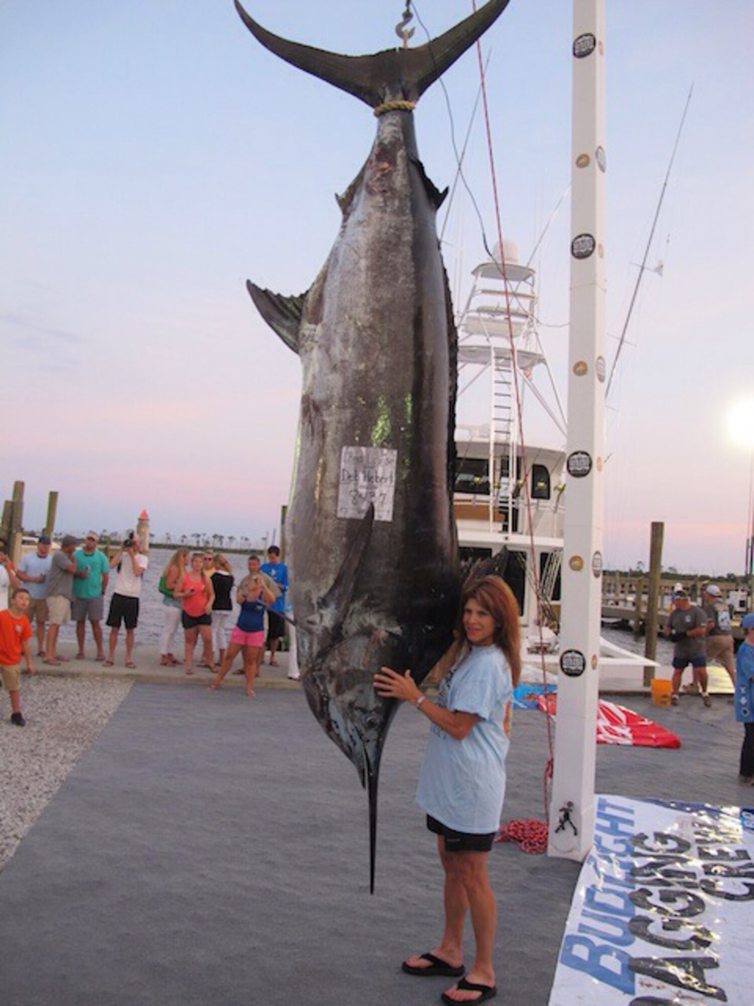 Col. (Dr.) Deb Hebert, stands next to her prize-winning catch June 6, during the 17th Annual Billfish Classic Tournament in Biloxi, Miss.