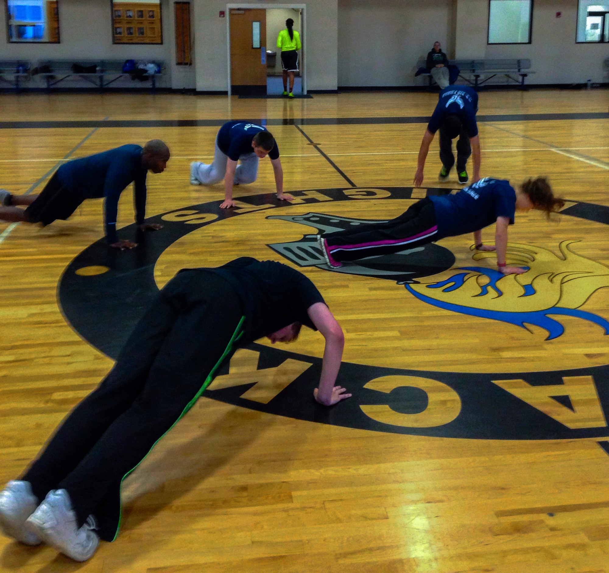 Air Force recruits in the delayed entry program do push-ups to prepare themselves for basic training March 27, 2014, at Little Rock Air Force Base, Ark. Along with working out, the recruits in the DEP learn facing movements, enlisted and officer ranks, reporting statements and Air Force core values. (Courtesy photo)