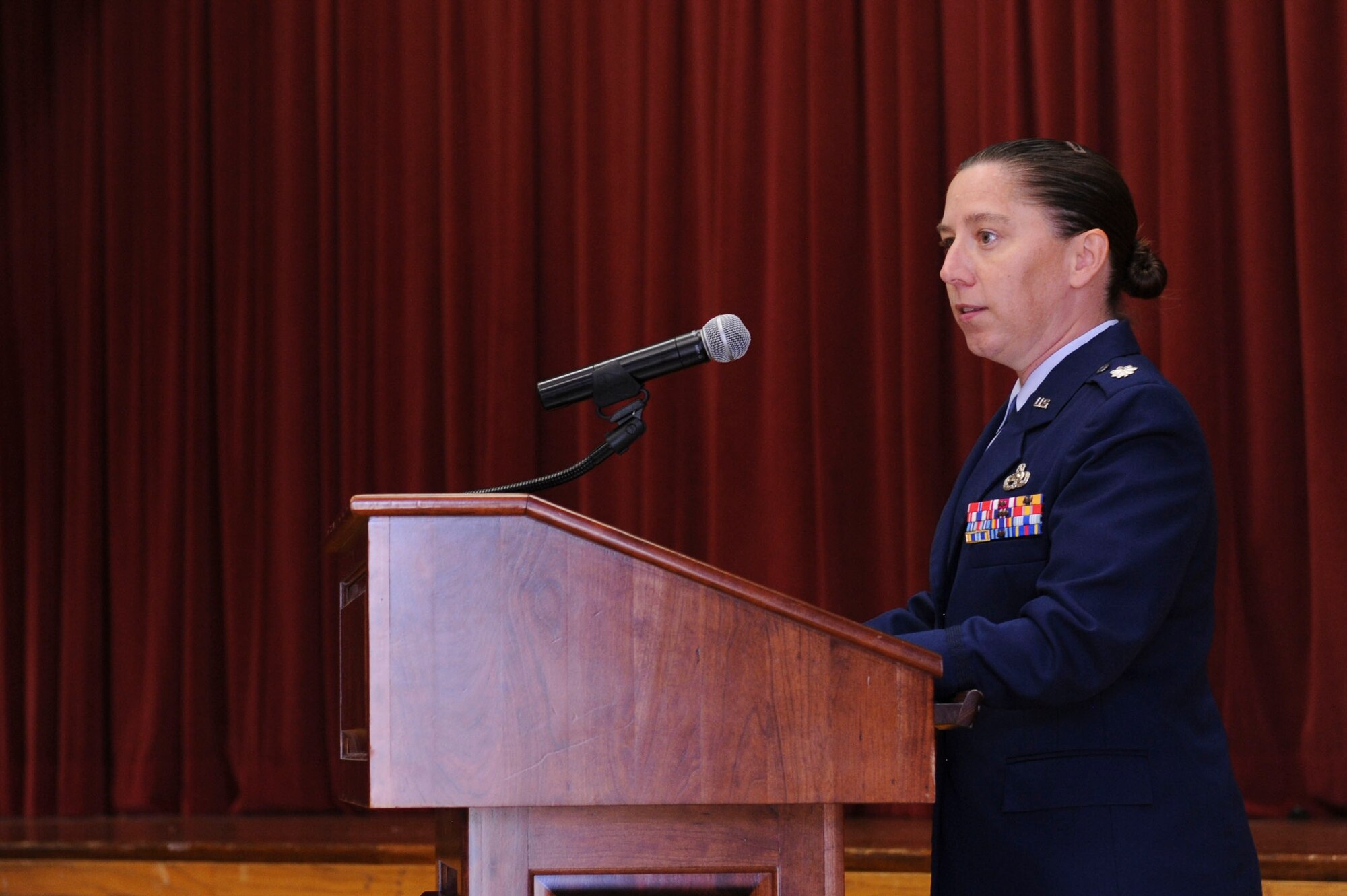Lt. Col. Heather Cooley, 19th Maintenance Squadron commander, speaks after accepting command of the 19th MXS July 16, 2014, at Little Rock Air Force Base, Ark. Cooley manages more than 600 personnel in charge of back shop maintenance. (U.S. Air Force photo by Airman 1st Class Cliffton Dolezal)