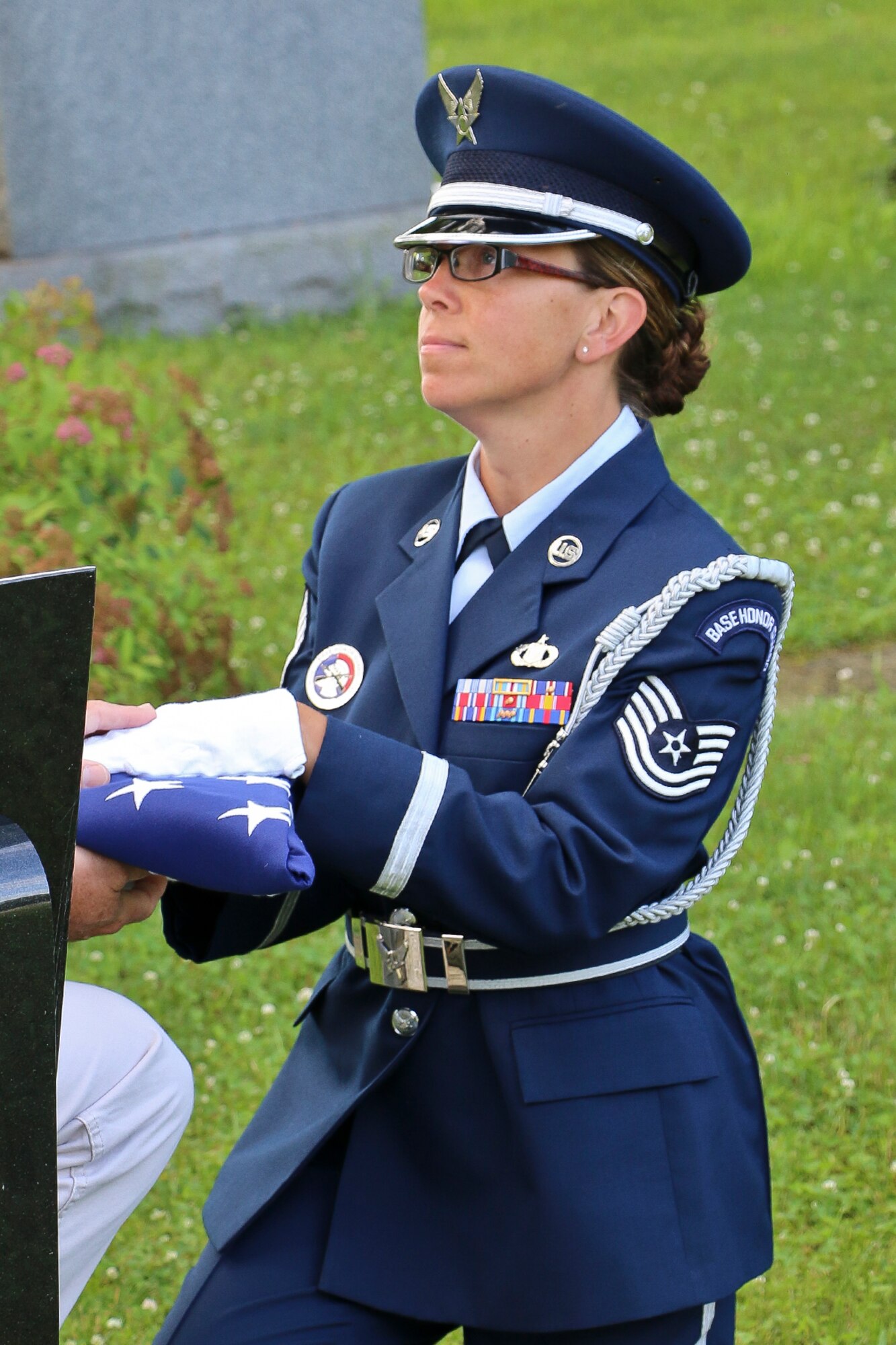 Tech. Sgt. Amy Ough, a New York Air National Guardsman at the Eastern Air Defense Sector in Rome, N.Y., presents a flag during a recent ceremony. Ough is the Air National Guard’s Outstanding Honor Guard Member of the Year. (U.S. Air National Guard photo by Tim Jones/Released)