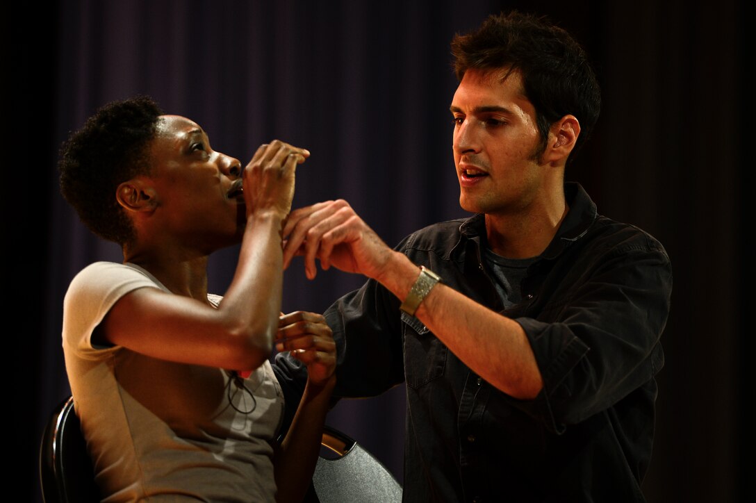 Sakinah Iman and Chris Beier, actors, present “Sex Signals,” a semi-improvisational skit at Langley Air Force Base, Va., July 30, 2014. The actors performed a two-person skit that included humor, education and audience interaction on the topic of sexual assault and consent. (U.S. Air Force photo by Senior Airman Kayla Newman/Released) 