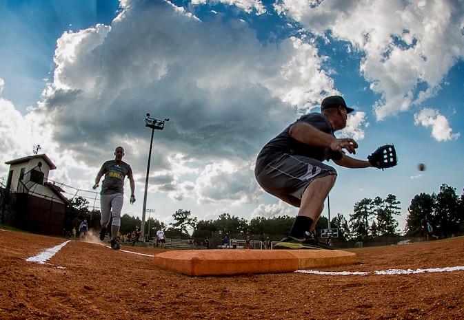 Charlie Glover, 628th Comptroller Squadron first baseman, completes a 6-3 (shortstop to first baseman) double play during the first round of the 2014 playoffs against the 628th Contracting Squadron July 29, 2014, at Joint Base Charleston, S.C. the 628th CPTS team moved on to the second round of playoffs after defeating the 628th CONS team by a score of 15-1. (U.S. Air Force photo/ Senior Airman Dennis Sloan)