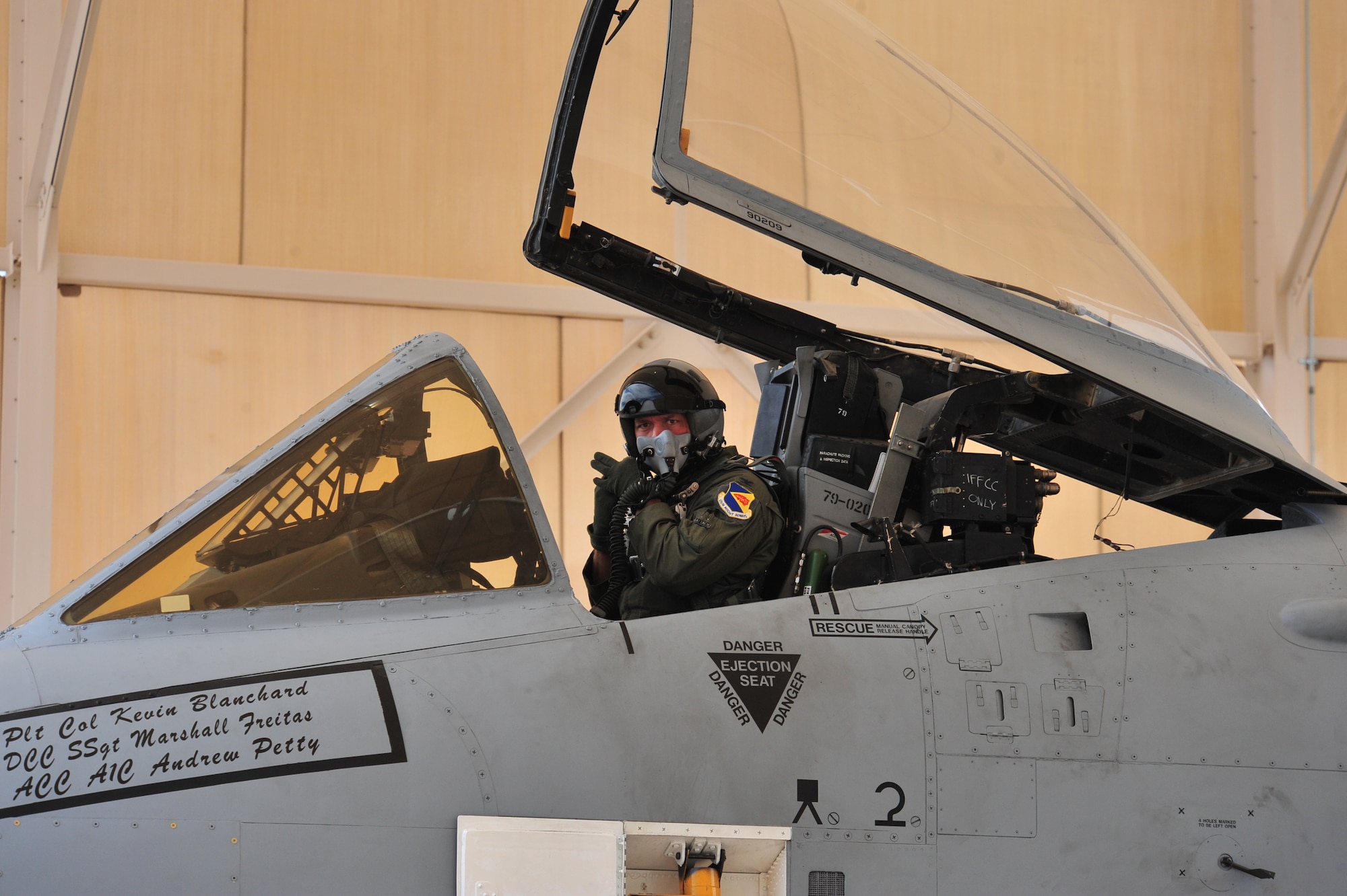 U.S. Air Force Col. Kevin E. Blanchard, 355th Fighter Wing commander, attaches his oxygen mask to his flight helmet before takeoff during his final flight in an A-10 Thunderbolt II at Davis-Monthan Air Force Base, Ariz., July 30, 2104.  Under Blanchard’s leadership, the 355 FW executed more than 34,000 flying hours, closing out the largest flying hour program in Air Combat Command.  (U.S. Air Force Photo by Airman 1st Class Chris Massey/Released)