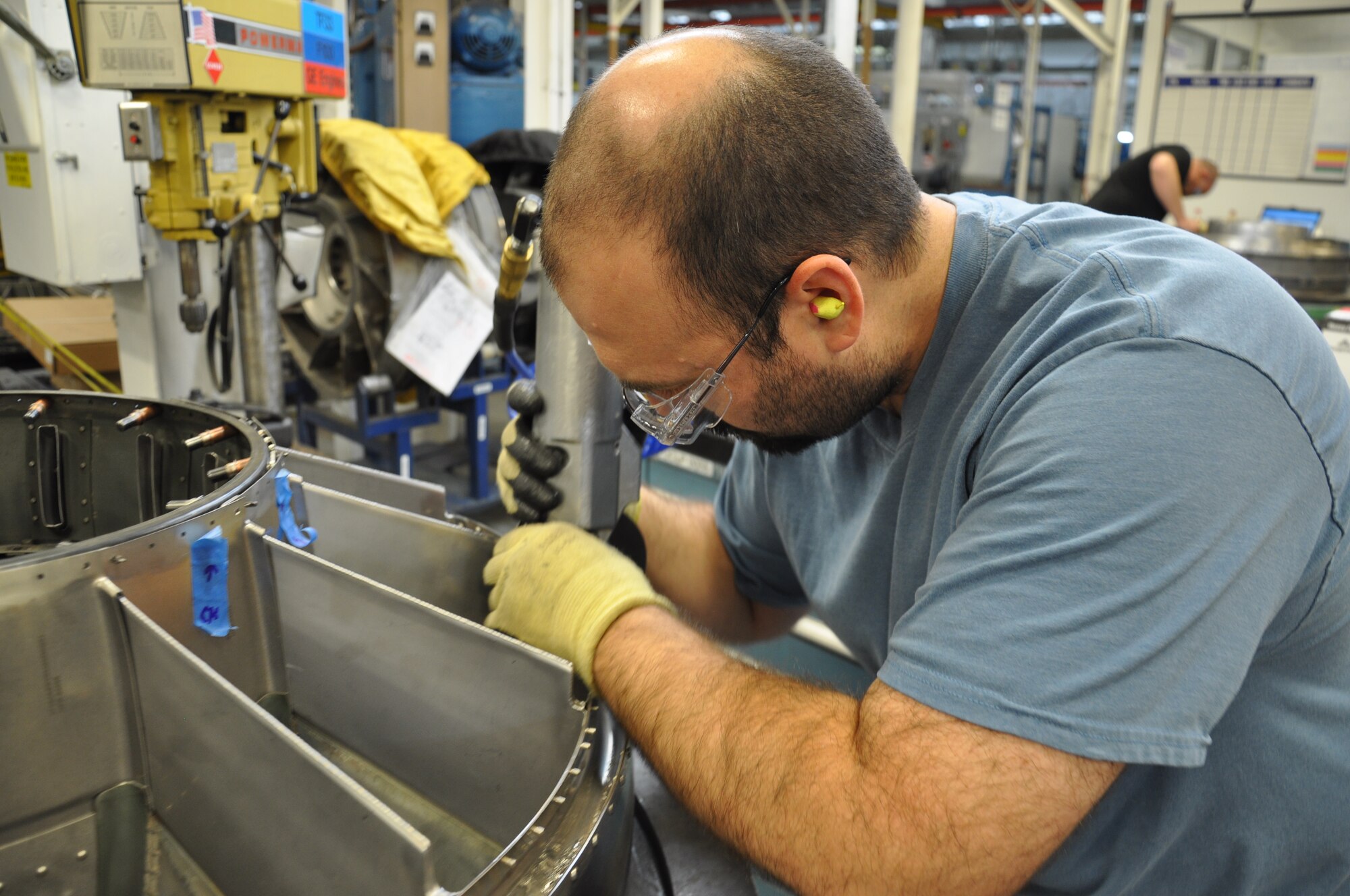 Micah Ingram, 548th Propulsion Maintenance Squadron, makes repairs to the F101 Turbine Frame.