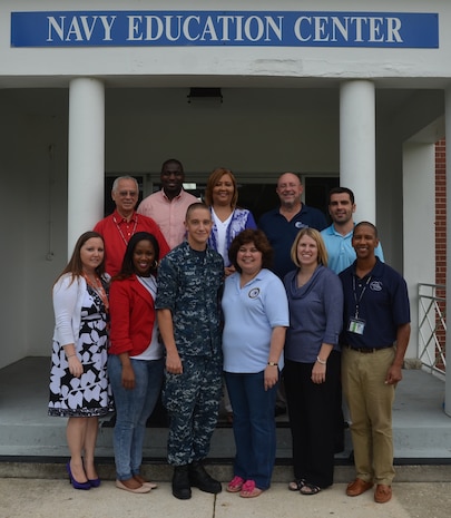 The Navy College Office recently relocated from building 302 to its new home in building 909, and held an Open House. The new location is approximately one quarter mile inside of Gate 1 which is at the end of Redbank Road. On hand were the Navy College staff along with representatives from several schools: (Front row left to right) Ashley Ann Woods, Trident Technical College; Jenvon Cherry, Columbia College; Petty Officer Third Class Justen Knape, Navy College assistant; Karen Sansbury, Navy College, Valerie Gold, National Test Center test examiner; and Keith McIver, Columbia College. (Back row left to right) Joe Daning, Trident Technical College; Corey Vanhorn, Strayer University; Syliva Gilliard, Excelsior College; Joel Menges, Coastline Community College and Ben Davis, St. Leo University. (U.S. Air Force photo/Eric Sesit)
