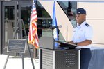 Col. Trent Edwards, 37th Training Wing commander, welcomes attendees to the ribbon-cutting ceremony of the new Recruit/Family In-processing and Information Center July 30, 2014 at Joint Base San Antonio-Lackland, Texas. (U.S. Air Force Photo by Benjamin Faske/Released)