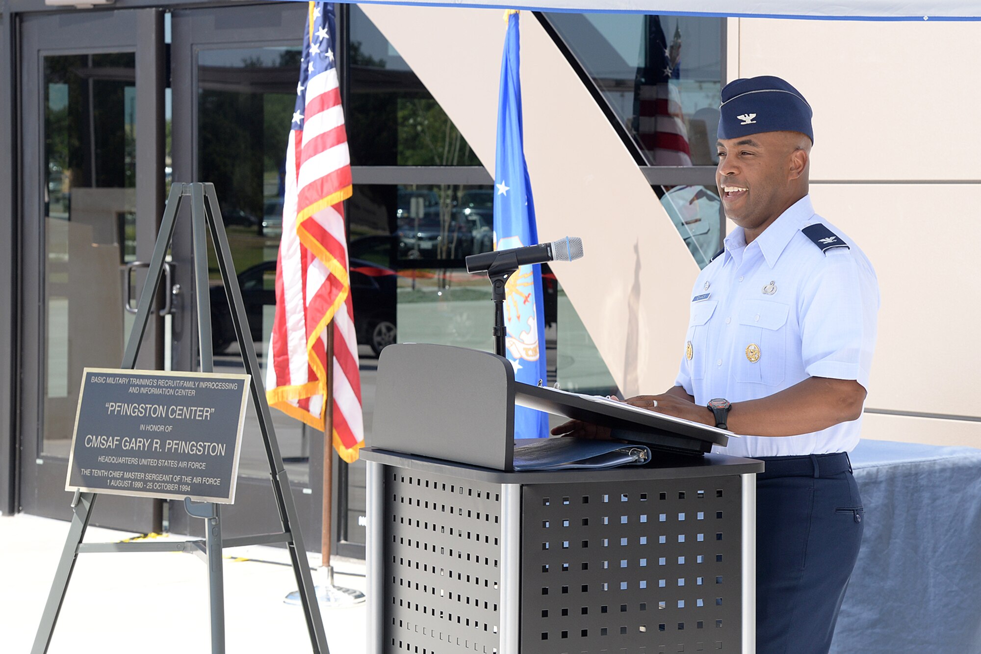 Col. Trent Edwards, 37th Training Wing commander, welcomes attendees to the ribbon-cutting ceremony of the new Recruit/Family In-processing and Information Center July 30, 2014 at Joint Base San Antonio-Lackland, Texas. (U.S. Air Force Photo by Benjamin Faske/Released)