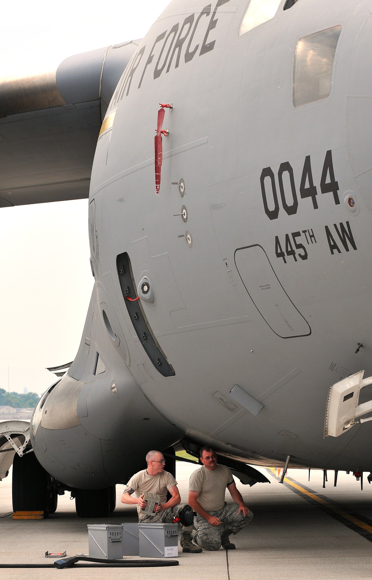 WRIGHT-PATTERSON AIR FORCE BASE, Ohio - Members of the 445th Aircraft Maintenance Squadron perform checks on a C-17 Globemaster III on the flightline here July 12, 2014. The 445 AMXS is continuing their above average trend for mission capable rate for the wing’s fleet of nine C-17s. (U.S. Air Force photo/Tech. Sgt. Frank Oliver)