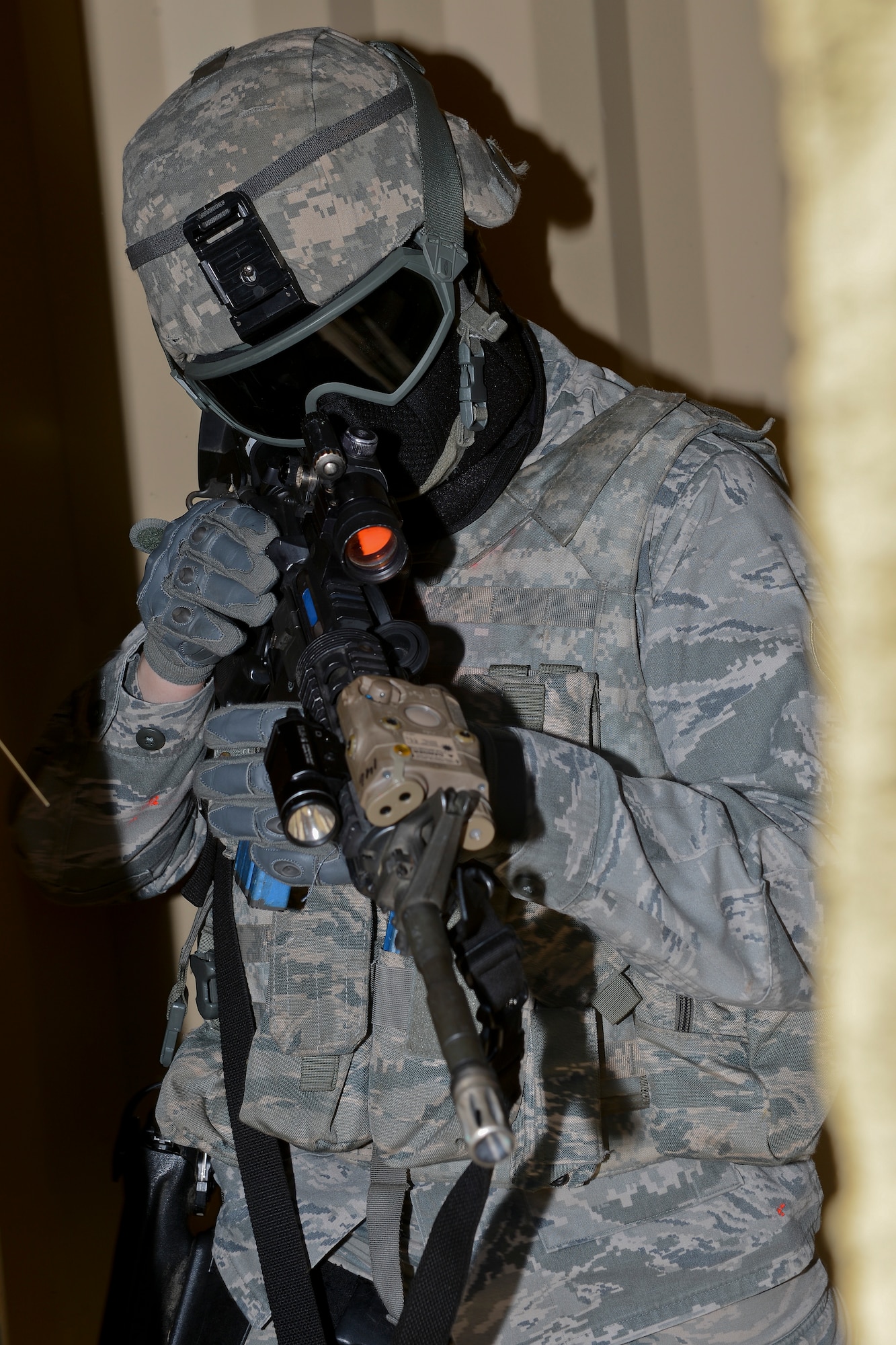 Senior Airman Richard Ringenbach, 48th Security Forces Squadron response force member, stands guard in a high-valued target scenario during force-on-force training at the Stanford Training Area in Norfolk, England, July 29, 2014. Defenders from the 48th SFS conducted a day of training at STANTA, an area that offers a realistic environment for Airmen to train. (U.S. Air Force photo by Airman 1st Class Trevor T. McBride)