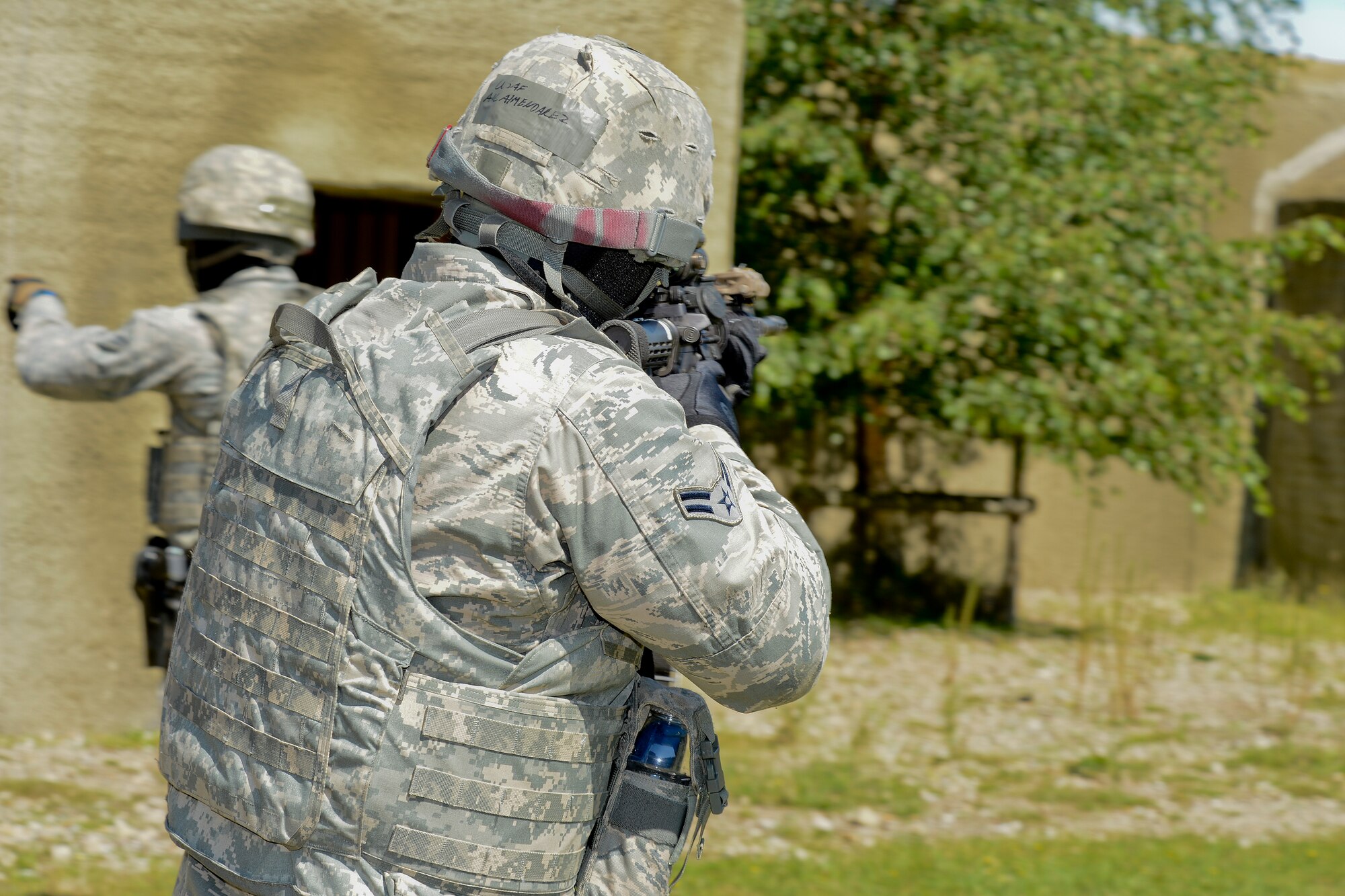 Airman 1st Class Roland Almendarez, 48th Security Forces Squadron response force member, utilizes specific tactics and movements in a high-valued target scenario during force-on-force training at the Stanford Training Area in Norfolk, England, July 29, 2014. Defenders from the 48th SFS conducted a day of training at STANTA, an area that offers a realistic environment for Airmen to train. (U.S. Air Force photo by Airman 1st Class Trevor T. McBride)