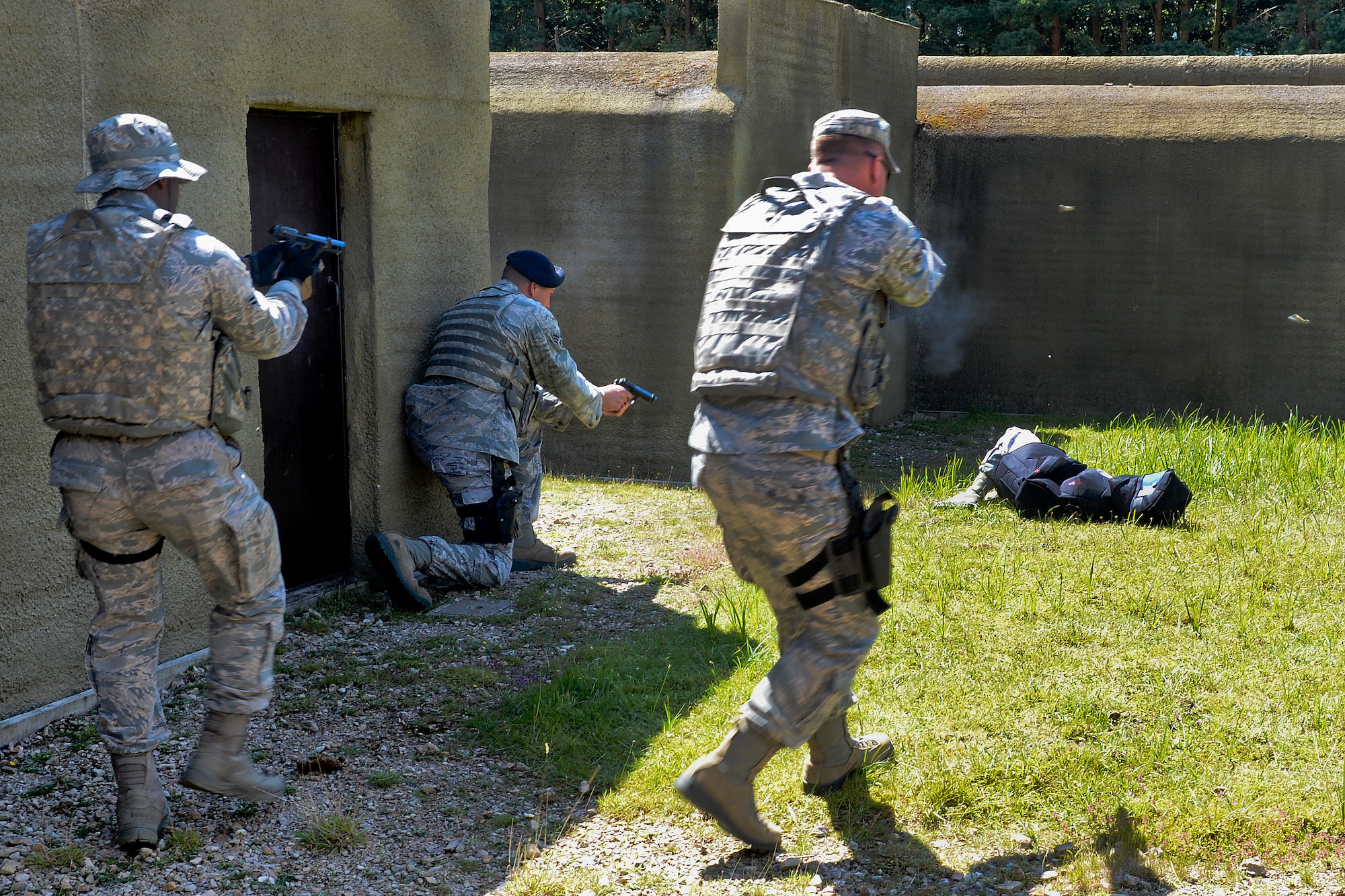 Defenders assigned to the 48th Security Forces Squadron eliminate a target in an active-shooter scenario during force-on-force training at the Stanford Training Area in Norfolk, England, July 29, 2014. (U.S. Air Force photo by Airman 1st Class Trevor T. McBride)