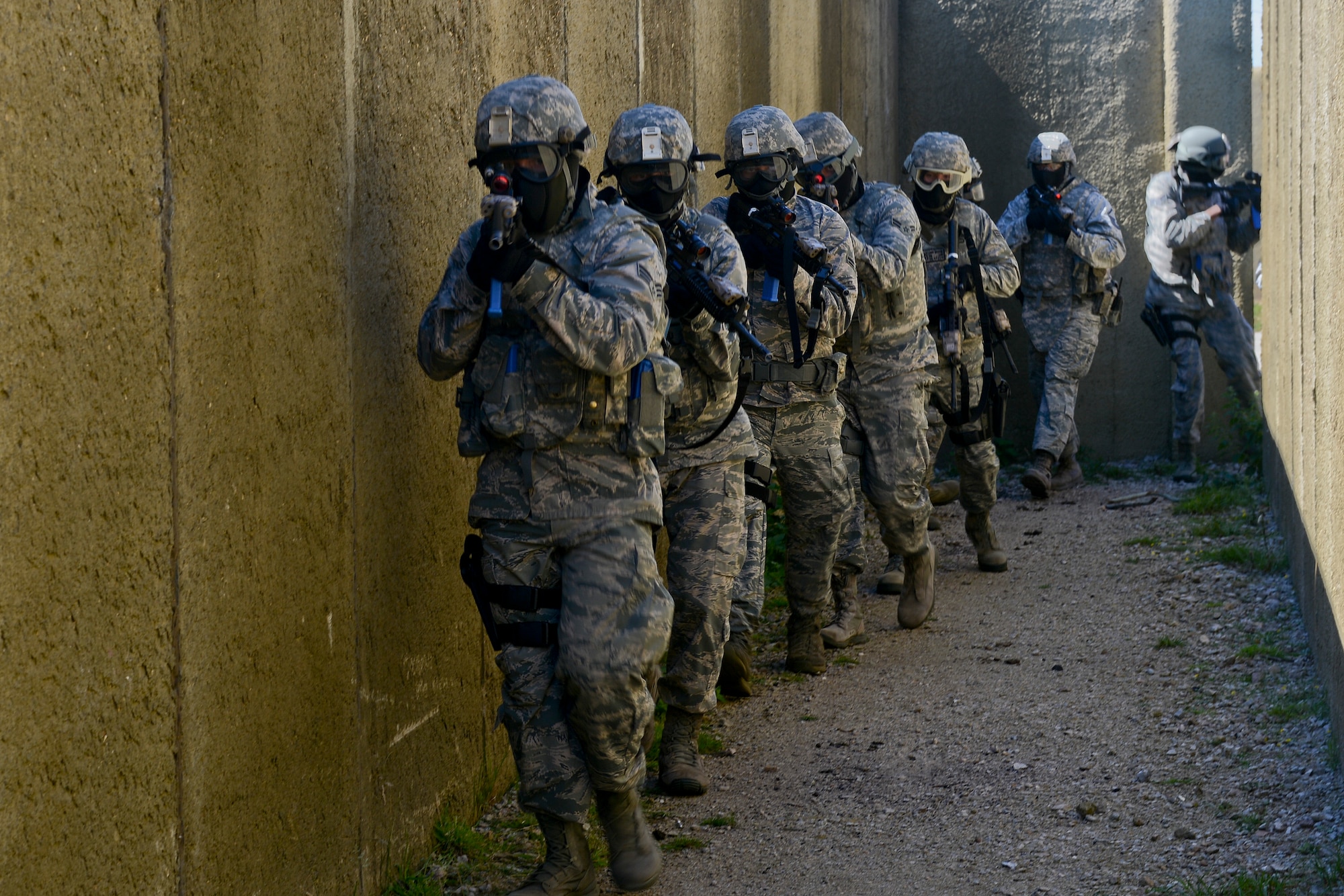 48th Security Forces Squadron Airmen use specific tactics and movements in a high-valued target scenario during force-on-force training at the Stanford Training Area in Norfolk, England, July 29, 2014. Defenders from the 48th SFS conducted a day of training at STANTA, an area that offers a realistic environment for Airmen to train. (U.S. Air Force photo by Airman 1st Class Trevor T. McBride)