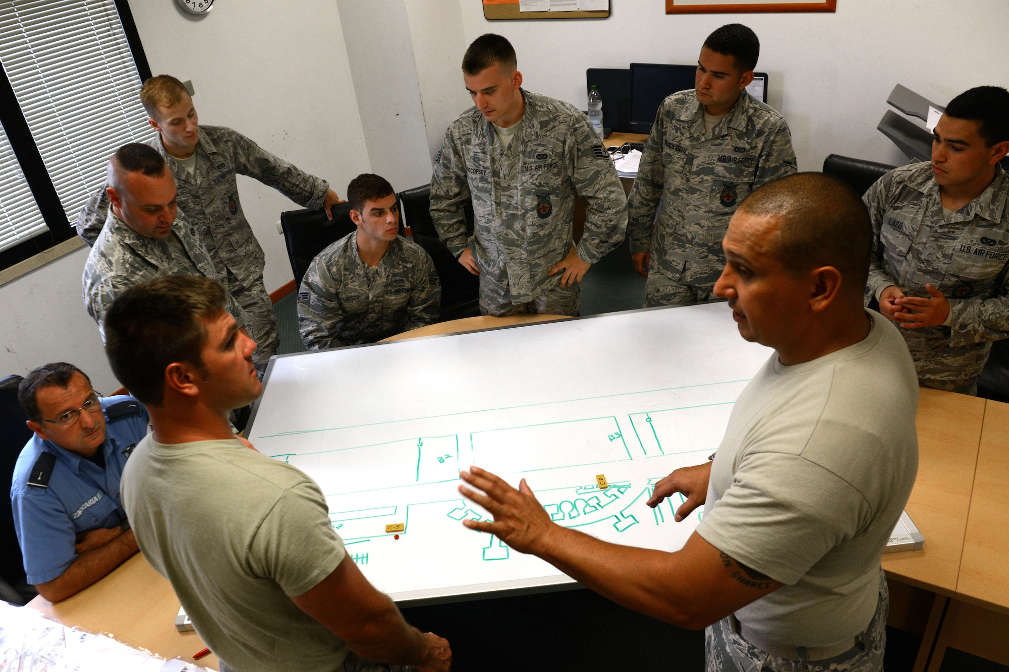 Firefighters from the 31st Civil Engineer Squadron conduct an open-discussion classroom training session, July 29, 2014, at Aviano Air Base, Italy. Every day, the firefighters go over proper operations for different firefighting scenarios, upcoming exercises and inspections, and other efficient ways to do their job. (U.S. Air Force photo/Airman 1st Class Ryan Conroy) 