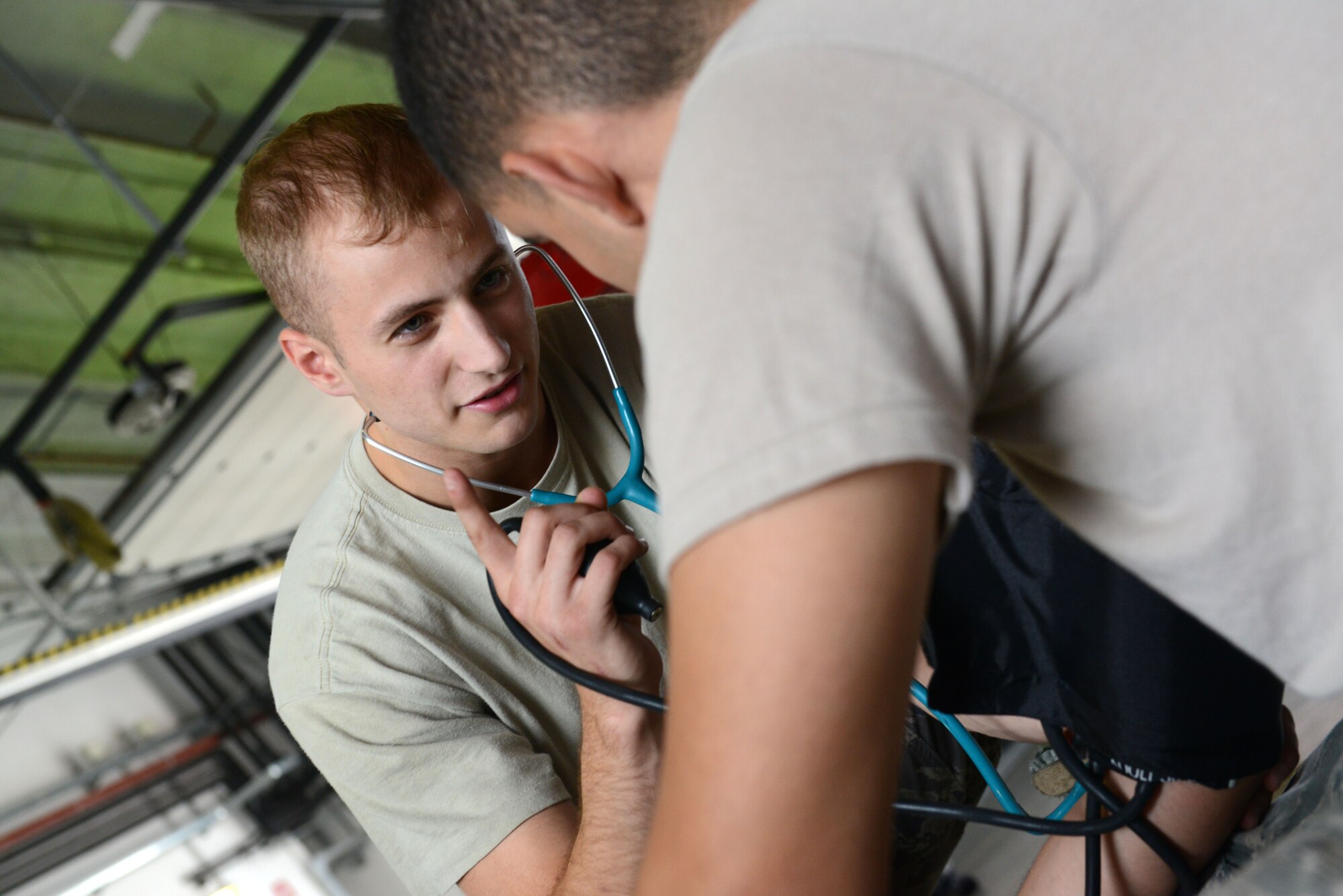 Airman 1st Class Joseph Cappel takes Airman 1st Class Christopher Lazo’s vitals during emergency medical response training, July 29, 2014, at Aviano Air Base, Italy. As first responders, firefighters must be knowledgeable in emergency medical care and cardiopulmonary resuscitation. Cappel and Lazo are 31st Civil Engineer Squadron firefighters. (U.S. Air Force photo/Airman 1st Class Ryan Conroy) 