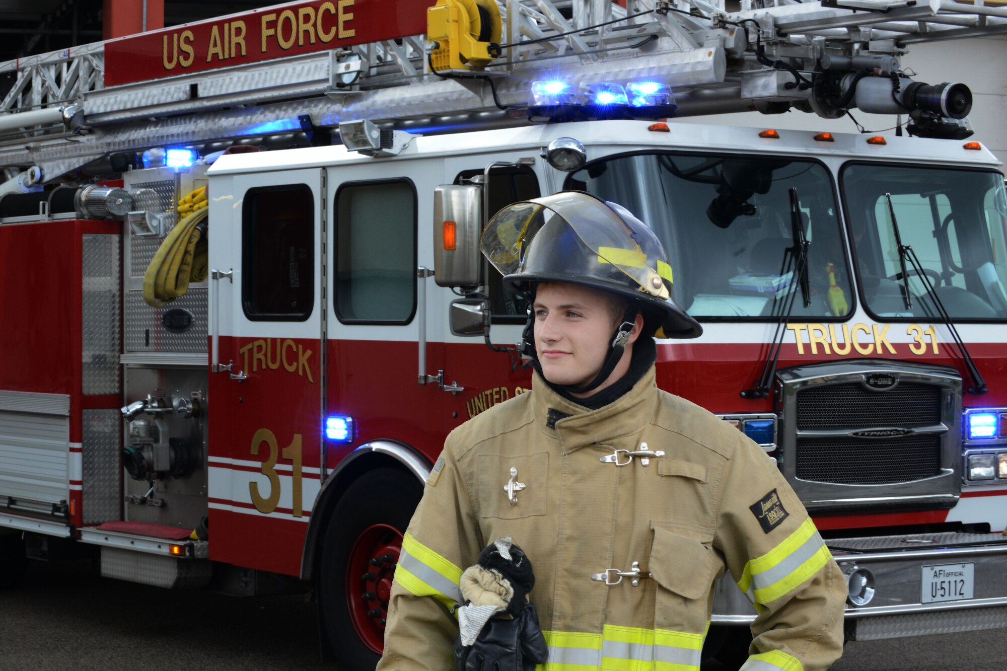 Airman 1st Class Joseph Cappel, 31st Civil Engineer Squadron firefighter, stands in front of truck 31, July 29, 2014, at Aviano Air Base, Italy. A firefighter’s daily duties include protecting people, property and the environment from fires and disasters through fire prevention, firefighting, rescue and hazardous material responses. (U.S. Air Force photo/Airman 1st Class Ryan Conroy) 