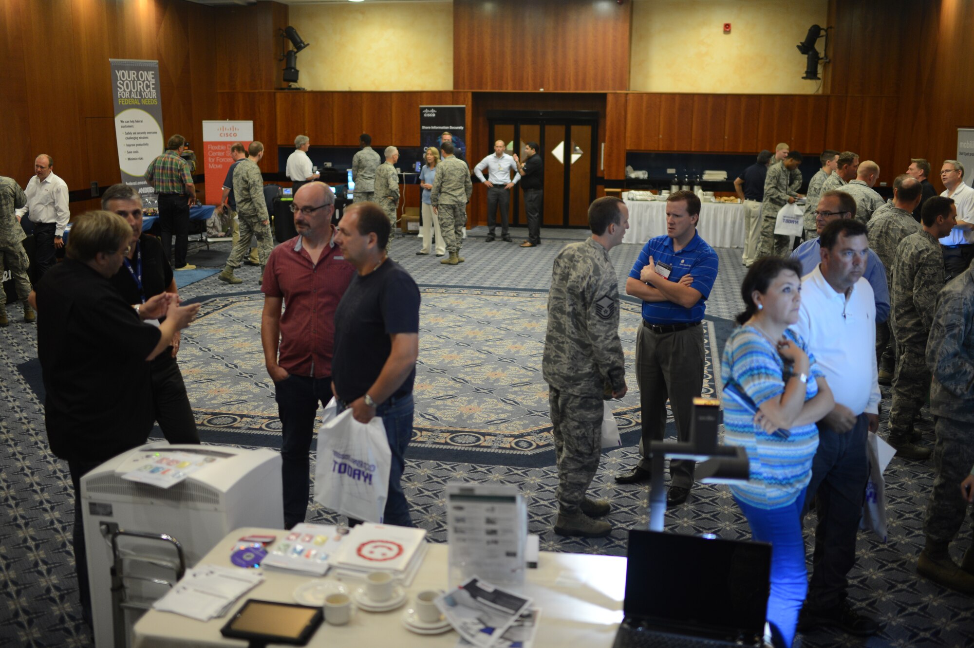 Members of the Spangdahlem community attend the 2014 Spangdahlem Technology Expo at Club Eifel, July 30, 2014. Twelve vendors participated in the event to showcase their products. (U.S. Air Force photo by Senior Airman Gustavo Castillo/Released)