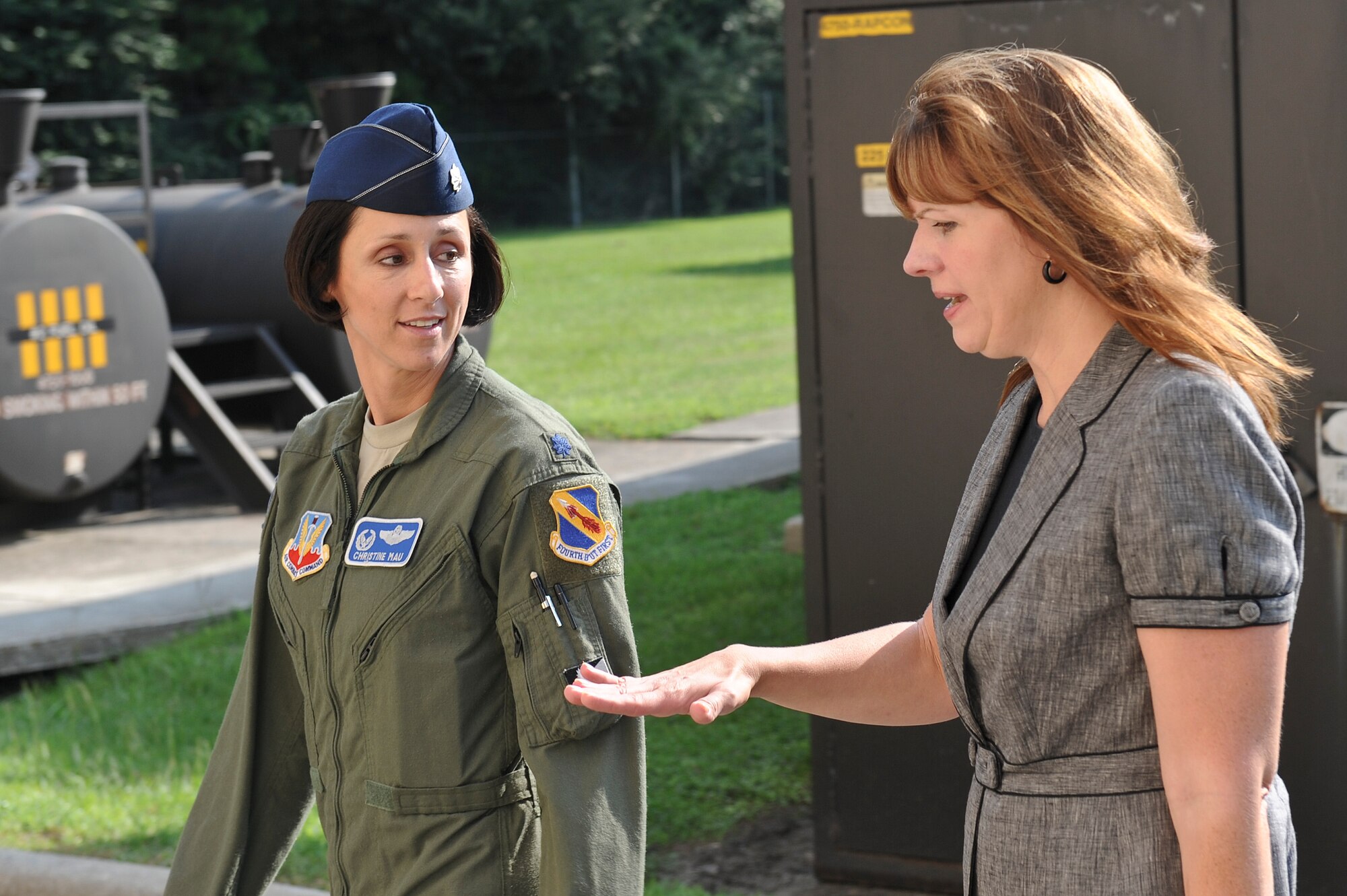 Lt. Col. Christine Mau (left), 4th Operations Support Squadron commander, greets Jennifer Gradnigo (right), military liaison for Senator Kay Hagan, during an installation tour July 30, 2014, at Seymour Johnson Air Force Base, North Carolina. Mau briefed Gradnigo of the plans to replace the Air Traffic Control Tower with a new facility slated to begin construction in 2016. (U.S. Air Force photo/Airman 1st Class Aaron J. Jenne)