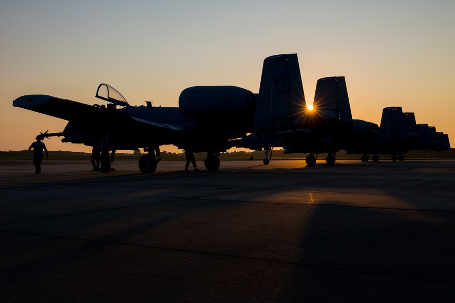 Four A-10C Thunderbolt II aircraft line up prior to takeoff at Moody Air Force Base, Ga., July 24, 2014. Team Moody recently completed a “sortie surge,” a temporarily escalated operations tempo, by flying 212 sorties in four days. (U.S. Air Force photo by Airman 1st Class Ryan Callaghan/Released)