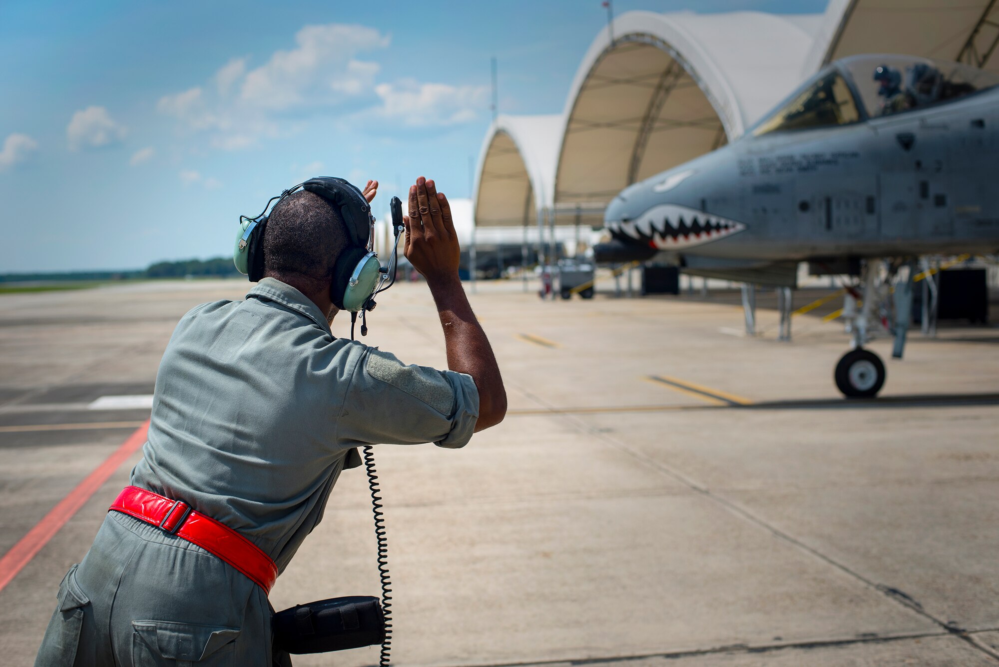 U.S. Air Force Senior Airman Phillip Boyd, 75th Aircraft Maintenance Unit crew chief, marshals an A-10C Thunderbolt II at Moody Air Force Base, Ga. July 30, 2014. Moody’s 74th and 75th Fighter Squadrons recently completed a “sortie surge,” a temporarily escalated operations tempo, by flying approximately 317 hours in four days. (U.S. Air Force photo by Airman 1st Class Ryan Callaghan/Released)