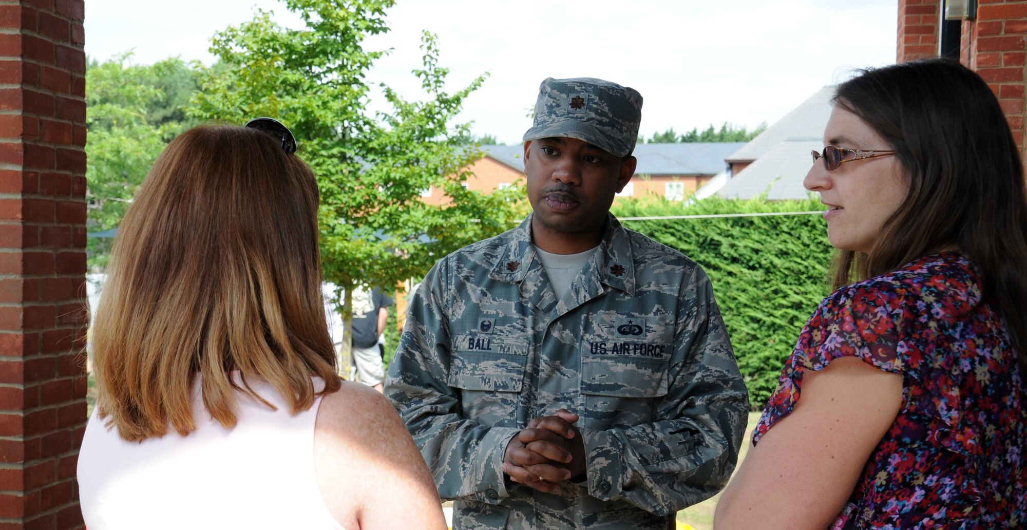 U.S. Air Force Maj. John Ball, 100th Force Support Squadron commander, speaks to attendees at the outdoor recreation center re-opening event July 30, 2014, on RAF Mildenhall, England. Following the official re-opening, guests had the opportunity to look in the new store and talk to staff about the services the center provides. (U.S. Air Force photo/Gina Randall/Released)