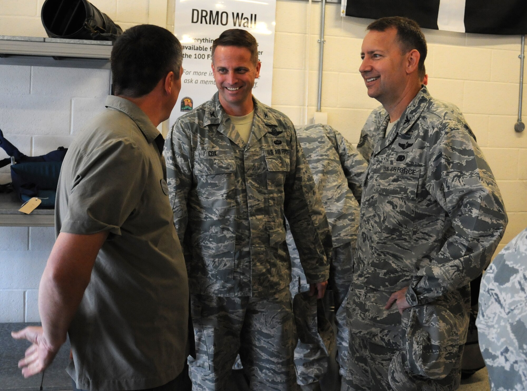 From left, David Wainwright, 100th Force Support Squadron Outdoor Recreation Center manager from Telford, England; U.S. Air Force Col. David Cox, 100th Air Refueling Wing vice commander; and U.S. Air Force Col. David Avila, 100th Mission Support Group commander, converse during the outdoor recreation center re-opening event July 30, 2014, on RAF Mildenhall, England. Following the official re-opening, guests had the opportunity to look in the new store and talk to staff about the services the center provides. (U.S. Air Force photo/Gina Randall/Released)