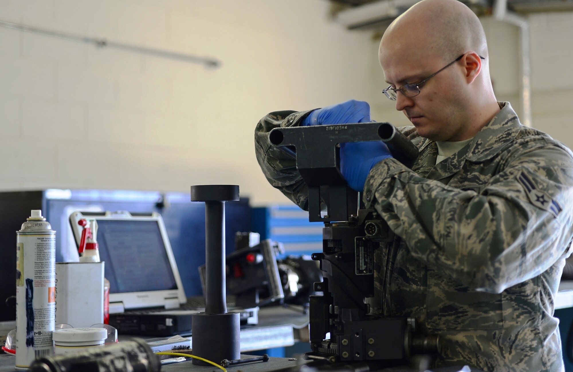 Airman 1st Class Michael Gormely, 748th Aircraft Maintenance Unit HH-60G Pave Hawk weapons team member, performs equipment maintenance at Royal Air Force Lakenheath, England, July 30, 2014. Gormely was nominated for a Liberty Spotlight because he displays the core value of Integrity First. (U.S. Air Force photo by Airman 1st Class Erin O’Shea/Released)
