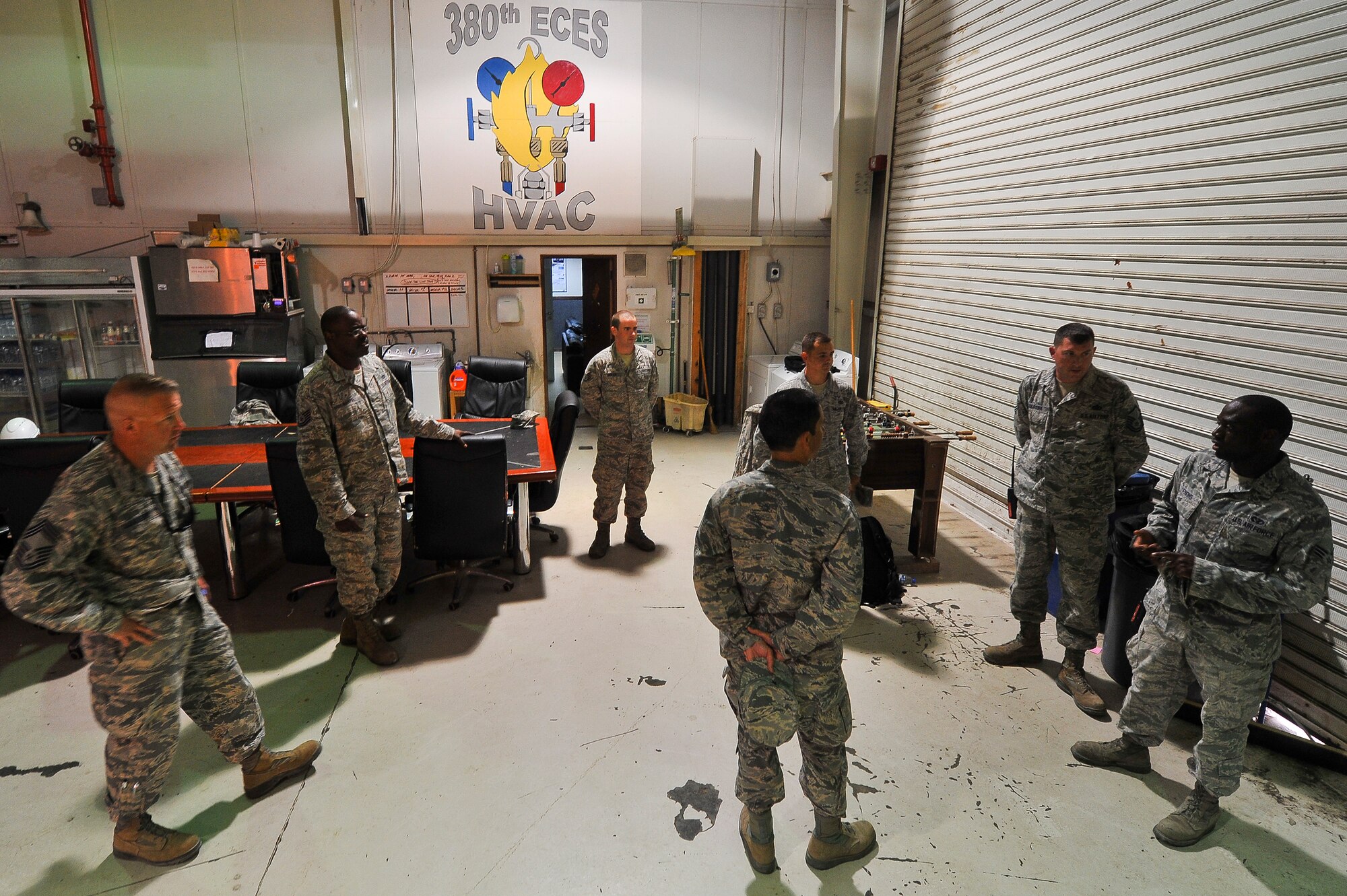 Brig. Gen. John T. Quintas, 380th Air Expeditionary Wing commander, receives a safety briefing July 28, 2014, at an undisclosed location in Southwest Asia. Quintas was spending the day working as a heating ventilation and air conditioning technician to gain a better understanding of how Airmen contribute to the mission. (U.S. Air Force photo by Tech. Sgt. Russ Scalf/Released)