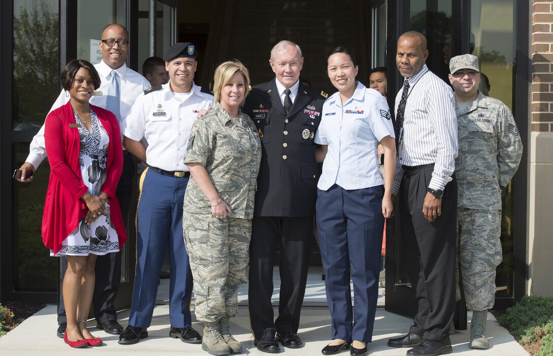Army Gen. Martin E. Dempsey, chairman of the Joint Chiefs of Staff, poses for a photo with staff members at the Gen. Jacob E. Smart building during the 2014 U.S. Air Force Senior Leader Orientation on Joint Base Andrews, Md., July 30, 2014. 