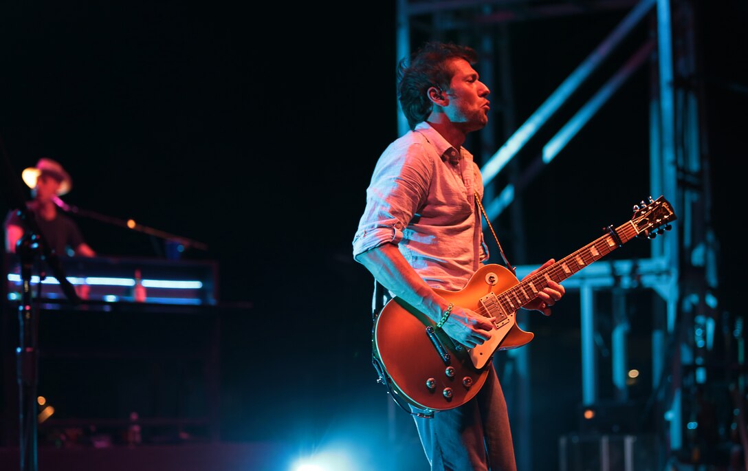 Brett Eldredge's guitarist performs for Combat Center fans alongside Eldredge and his band during the We Salute You celebration hosted at Lance Corporal Torrey L. Gray Field, May 17, 2014.