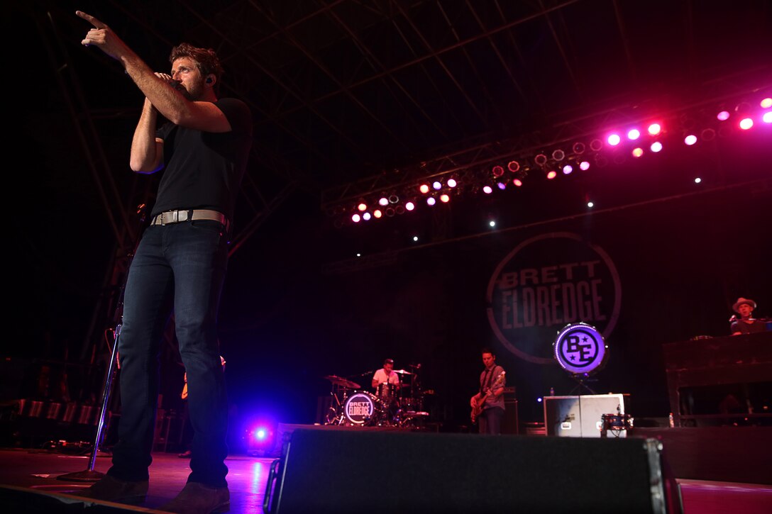 Brett Eldredge, country music star, points to Combat Center fans during the We Salute You celebration hosted at Lance Corporal Torrey L. Gray Field, May 17, 2014. The celebration was free and open to all service members and their families to participate in and watch.