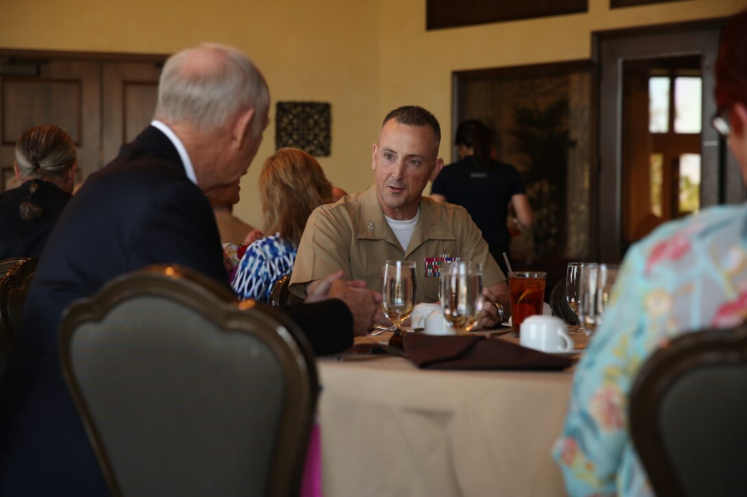Col. Matthew Jones, commanding officer, Marine Corps Tactics and Operations Group, sits down to lunch during a luncheon at the Classic Club in Palm Desert, Calif., May 15. The 1st Marine Division Association held a spousal appreciation luncheon at club. The association is made up of members of 1st Marine Division, past and present. They invited the spouses of 1st Marine Division Marines to thank them for their unyielding support and strength of character through their many years as part of the family. Each spouse was acknowledged by name and asked to stand as they were individually recognized and applauded.