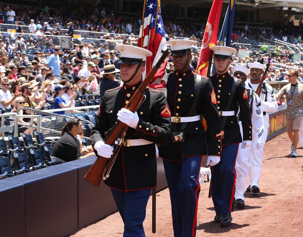 A joint Navy-Marine Corps color guard marches with the colors during their appearance at a military appreciation ceremony at a San Diego Padres baseball game at Petco Park, May 25, 2014. "It was a great time for camaraderie and reflection," said Navy Lt. Travis Jewell, chaplain, 3rd Battalion, 4th Marines, 7th Marine Regiment.