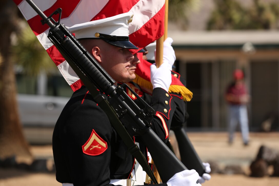 The 3rd Light Armored Reconnaissance Battalion color guard marches during the Grubstake Days Parade held in Yucca Valley, Calif., May 24, 2014. The crowd cheered "Oorah" and "Semper Fi" as the Marines passed them during the parade.