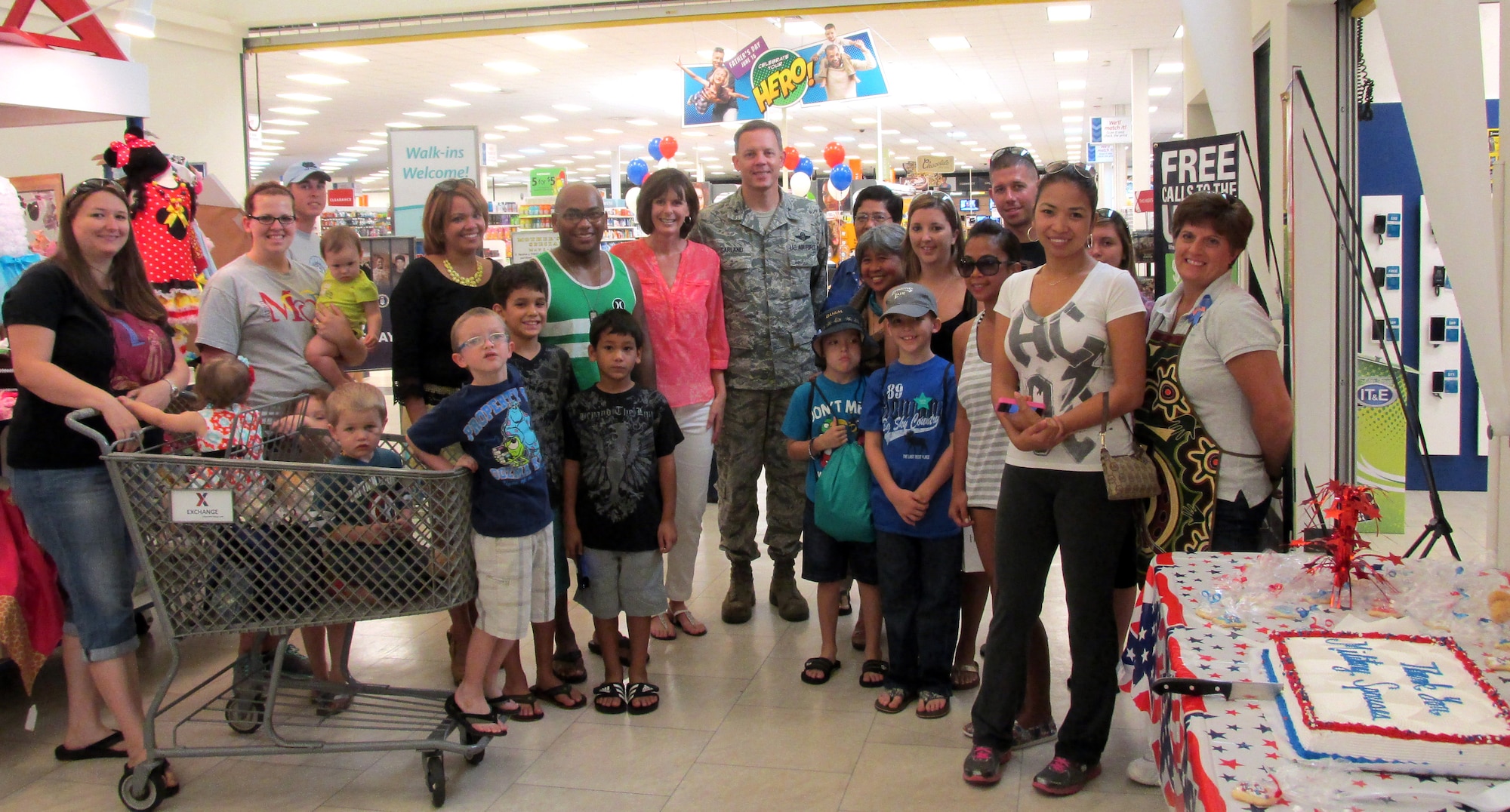 36th Wing commander Brig. Gen. Steven Garland poses with military spouses during the Military Spouse Application Day event at the Base Exchange on Andersen Air Force Base, Guam May 17, 2014. The 36th Wing Airman and Family Readiness Center hosted 15 helping agencies, who provided information tables to support more than 200 military spouses during the event. (Courtesy photo/Released)