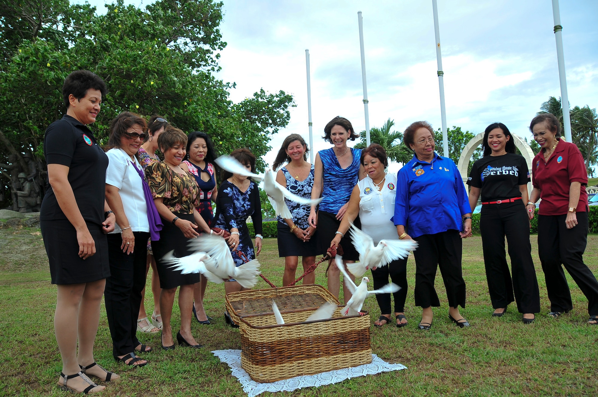 Distinguished guests for the annual Memorial Day Ceremony at the Guam Governor’s Complex release “freedom birds” at the end of the ceremony on May 26, 2014. Earlier in the Memorial Day ceremony, the guests laid a wreath on a representation of the Tomb of the Unknown Warrior, to honor service members whose remains are still missing or haven’t been identified. (U.S. Air Force Photo by Staff Sgt. Brok McCarthy/Released)