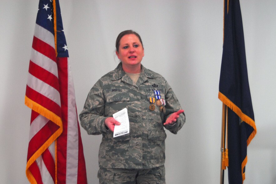 Senior Master Sgt. Ruth Mortag thanks the people who supported her during her deployment at a ceremony to award her numerous medals and accolades at the 120th Fighter Wing April 5. Mortag was deployed to Afghanistan for six months in 2013. (National Guard photo/Staff Sgt. Michael Touchette)