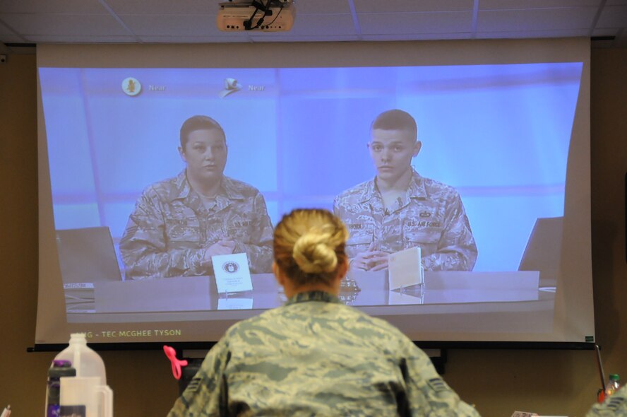 Instructors discuss the subject of military briefings as Senior Airman Ashlee Wajer watches, listens and takes notes. The course allows student to use various learning styles to retain the information presented. (National Guard photo/Staff Sgt. Michael Touchette) 