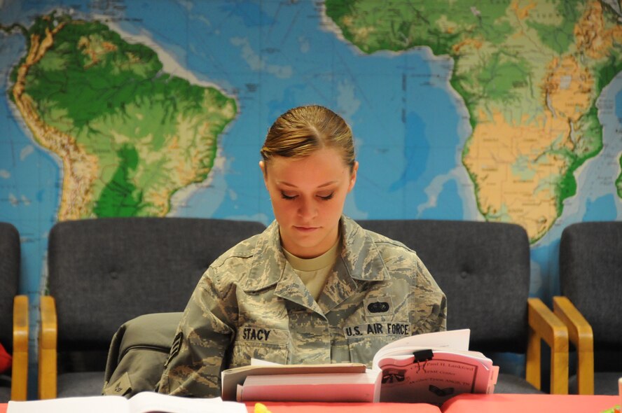 Senior Airman Ashlynn Stacy, 219th RED HORSE Squadron, refers to her text during a lecture at the Satellite Airman Leadership School May 3. Stacy is one of 10 Airmen enrolled in the course consisting of 5 weekends at Malmstrom Air Force Base, Mont., and two weeks at McGhee Tyson Air National Guard Base, Tenn., in June.  (National Guard photo/Staff Sgt. Michael Touchette) 