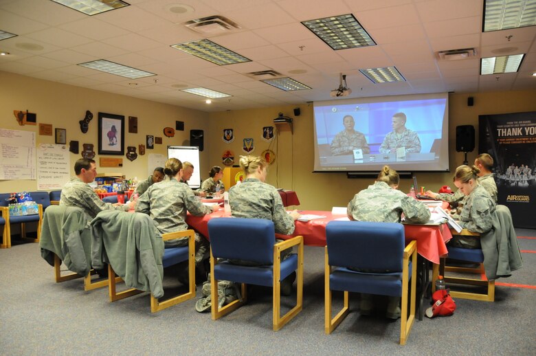 Airmen from the Montana Air National Guard receive a class from onscreen instructors during a Satellite Airman Leadership School course being held at the 219th RED HORSE Sqaudron facility at Malmstrom Air Force Base, Mont., on May 3. Airmen receive training from the instructors, located at McGhee Tyson Air National Guard Base, Tenn., via two-way electronic communication. (National Guard photo/Staff Sgt. Michael Touchette) 