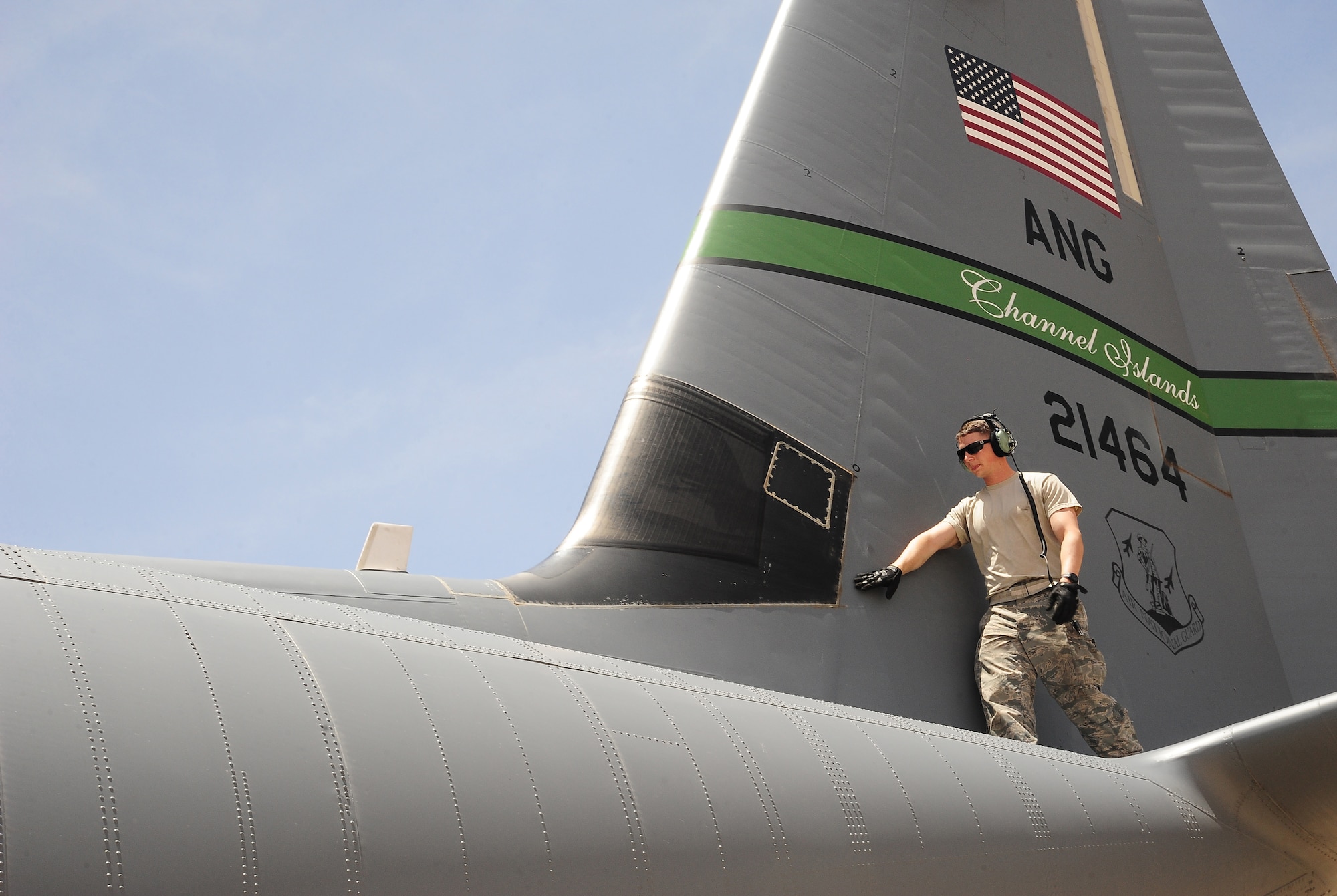 U.S. Air Force Senior Airman Beau Lewis, a crew chief with the 146th Aircraft Maintenance Squadron at Channel Islands Air National Guard Station, Calif., checks the tail of a C-130J Hercules during Exercise Eager Lion May 29, 2014, at an air base in northern Jordan. The over 6,000 U.S. forces participating in Eager Lion include troops from all branches of the U.S. military. (U.S. Air Force photo by Staff Sgt. Brigitte N. Brantley/Released)