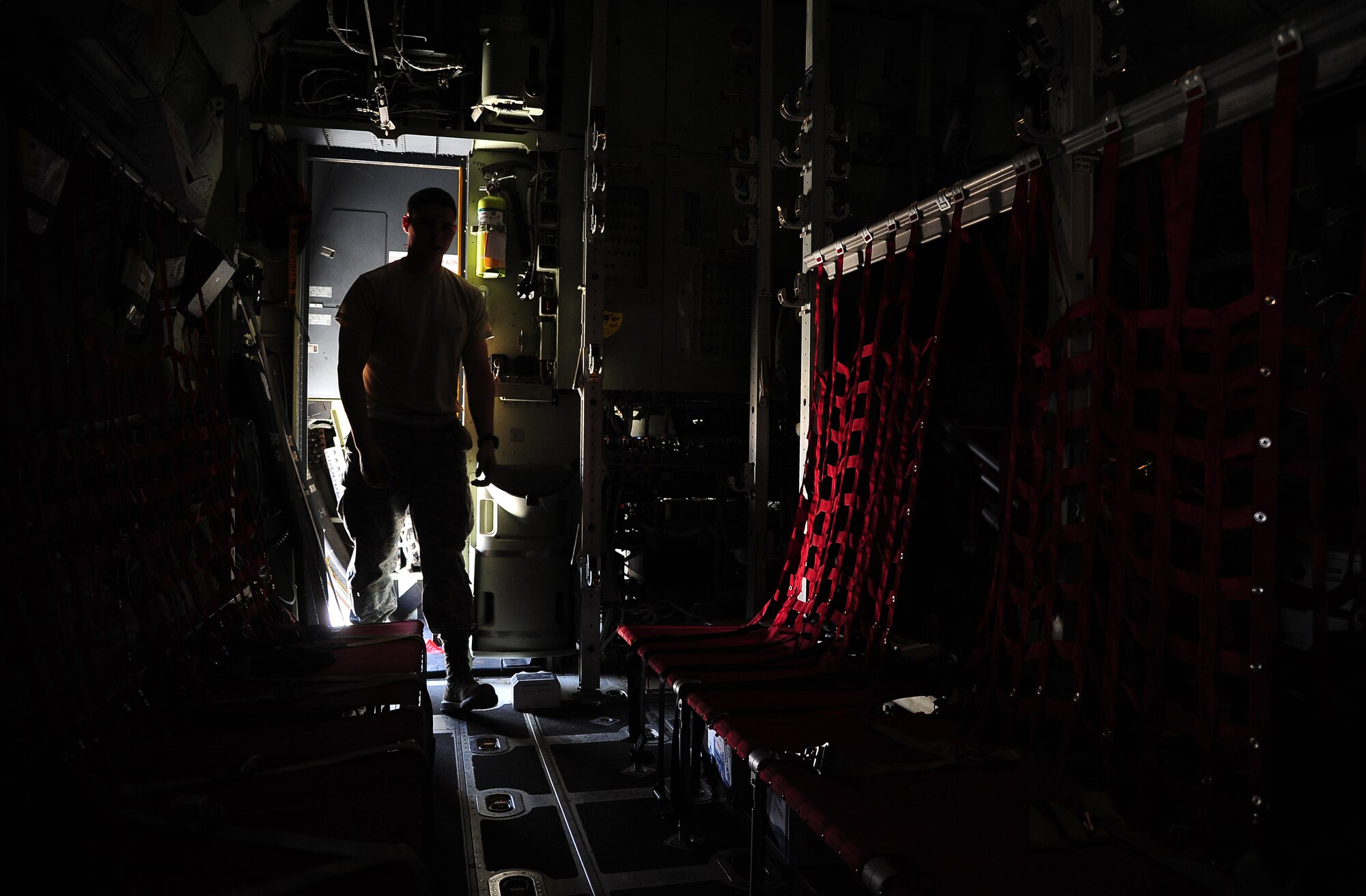 U.S. Air Force Senior Airman Beau Lewis, a crew chief with the 146th Aircraft Maintenance Squadron at Channel Islands Air National Guard Station, Calif., does routine maintenance on a C-130J Hercules during Exercise Eager Lion May 29, 2014, at an air base in northern Jordan. During the annual exercise, more than 12,500 personnel from over 20 nations joined forces to enhance regional security and stability through various scenarios. (U.S. Air Force photo by Staff Sgt. Brigitte N. Brantley/Released)