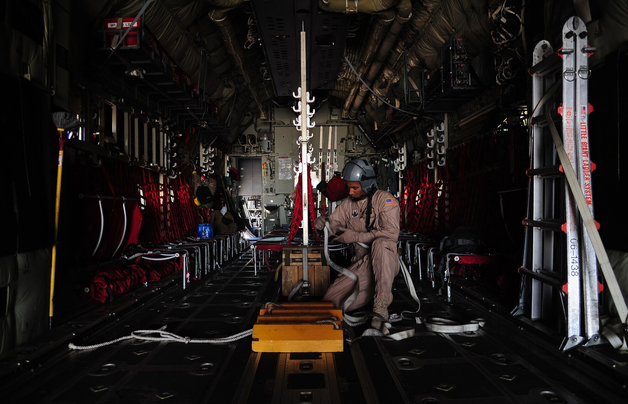 U.S. Senior Airman Cameron Davis, a loadmaster with the 115th Airlift Squadron at Channel Islands Air National Guard Station, Calif., prepares a C-130J Hercules for a mission during Exercise Eager Lion May 26, 2014, at an air base in northern Jordan. Throughout the exercise, Guardsmen from the 115th provided airlift support for U.S. and partner nation aircraft that were practicing various missions. (U.S. Air Force photo by Staff Sgt. Brigitte N. Brantley/Released)