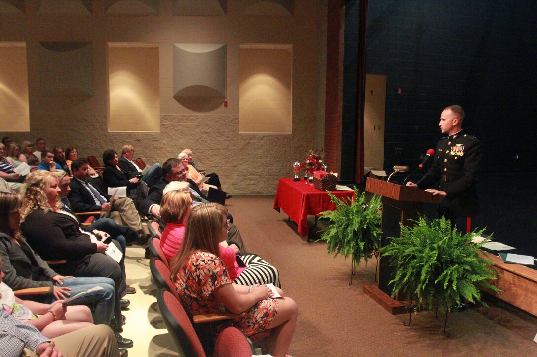 U.S. Marine Corps Capt. Eric Albright, the executive officer of Recruiting Station Charleston, speaks during Boyd County High School’s awards night Ashland, Ky., May 29, 2014. Albright presented senior Joseph Hupp with a $150,000 Naval Reserve Officers Training Corps Marine Option Scholarship. The scholarship will cover the cost of tuition, pay for some of his books, and provide a small living stipend. (U.S. Marine Corps photo by Sgt. Tyler Hlavac/Released)