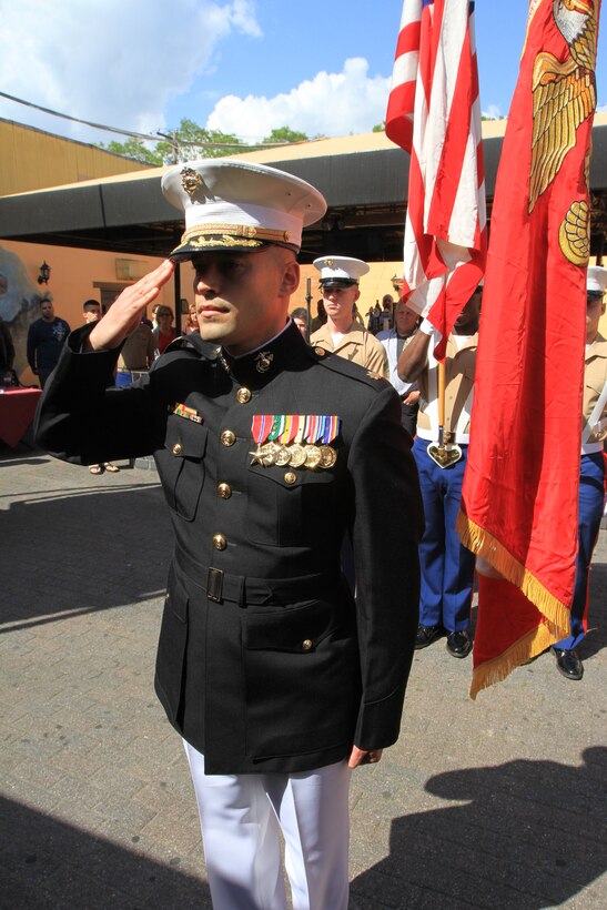 Maj. Alexander E. Gilbert, the assistant logistics officer with 1st Marine Corps District, salutes as the national anthem is played during his retirement ceremony May 30. (U.S. Marine Corps photo by Capt. Timothy Irish).