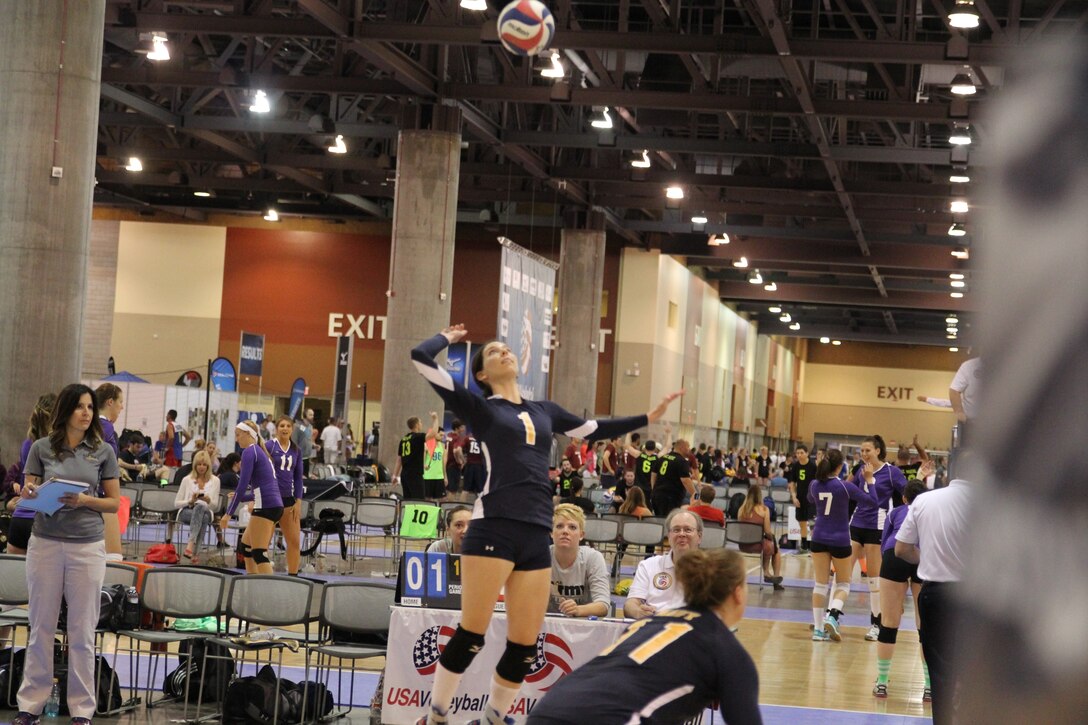 Navy's LT Christine Rostowfske prepares for the spike during the 2014 Armed Forces Championship in conjunction with the 2014 USA Volleyball National Championship in Phoenix, AZ