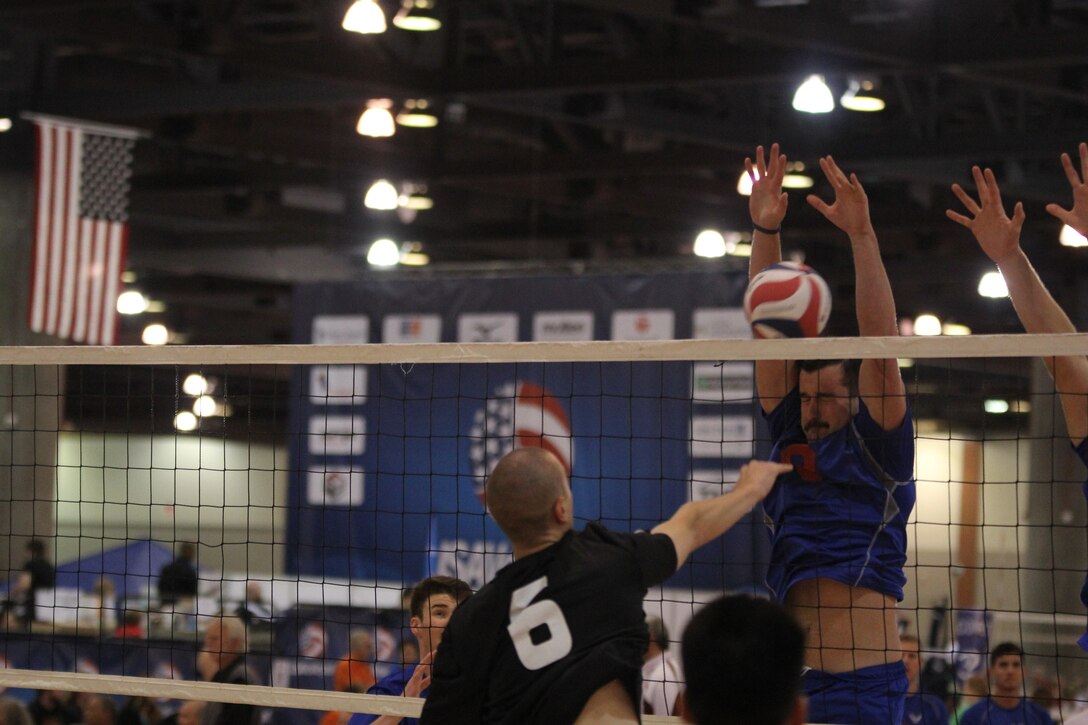 USAF A1C Michael Sofley (Beale AFB, CA) blocks a huge spike from Clay Dooley (Camp Pendleton, CA)
