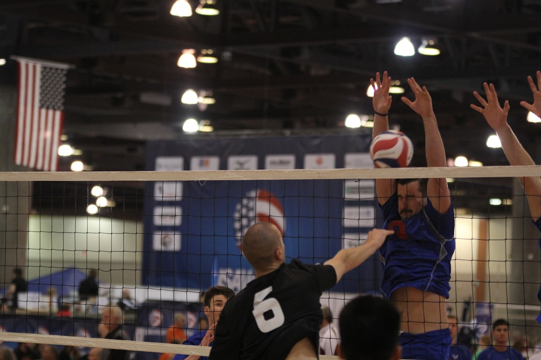 USAF A1C Michael Sofley (Beale AFB, CA) blocks a huge spike from Clay Dooley (Camp Pendleton, CA)